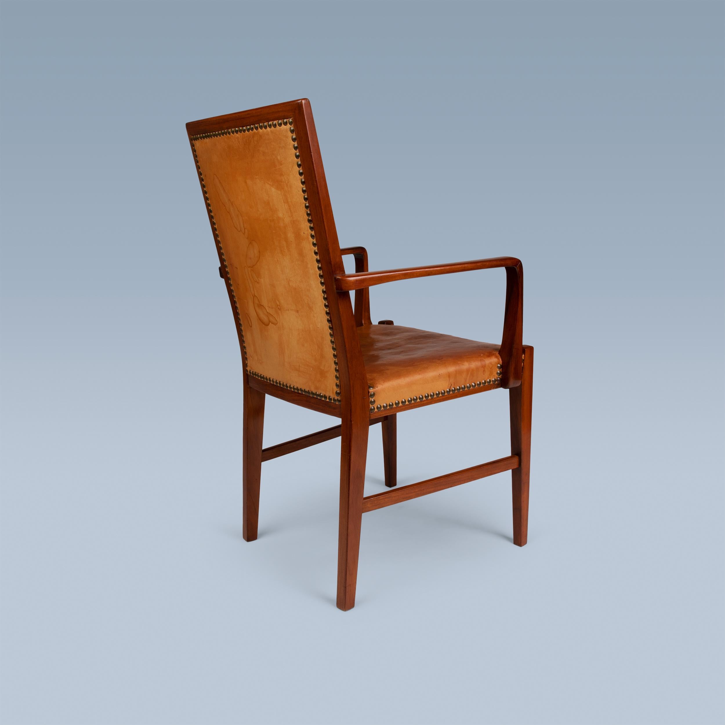 20th Century High back nut wood armchair with leather seat and back by Danish cabinetmaker For Sale
