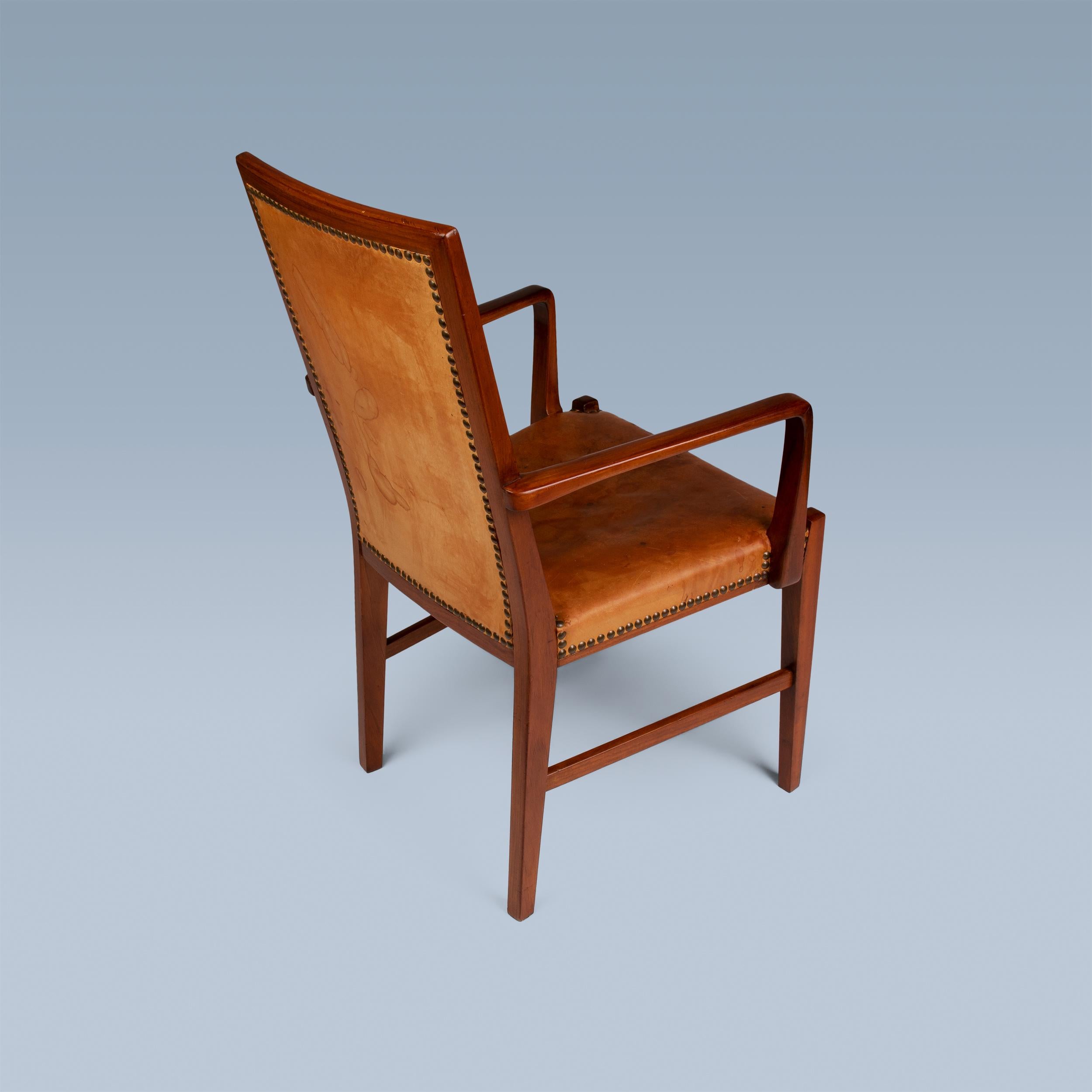 Brass High back nut wood armchair with leather seat and back by Danish cabinetmaker For Sale