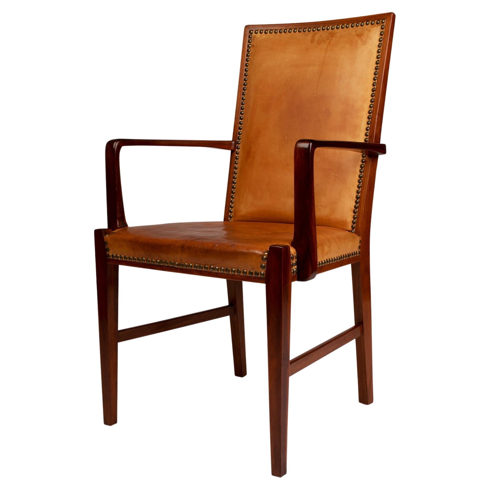 High back nut wood armchair with leather seat and back by Danish cabinetmaker For Sale