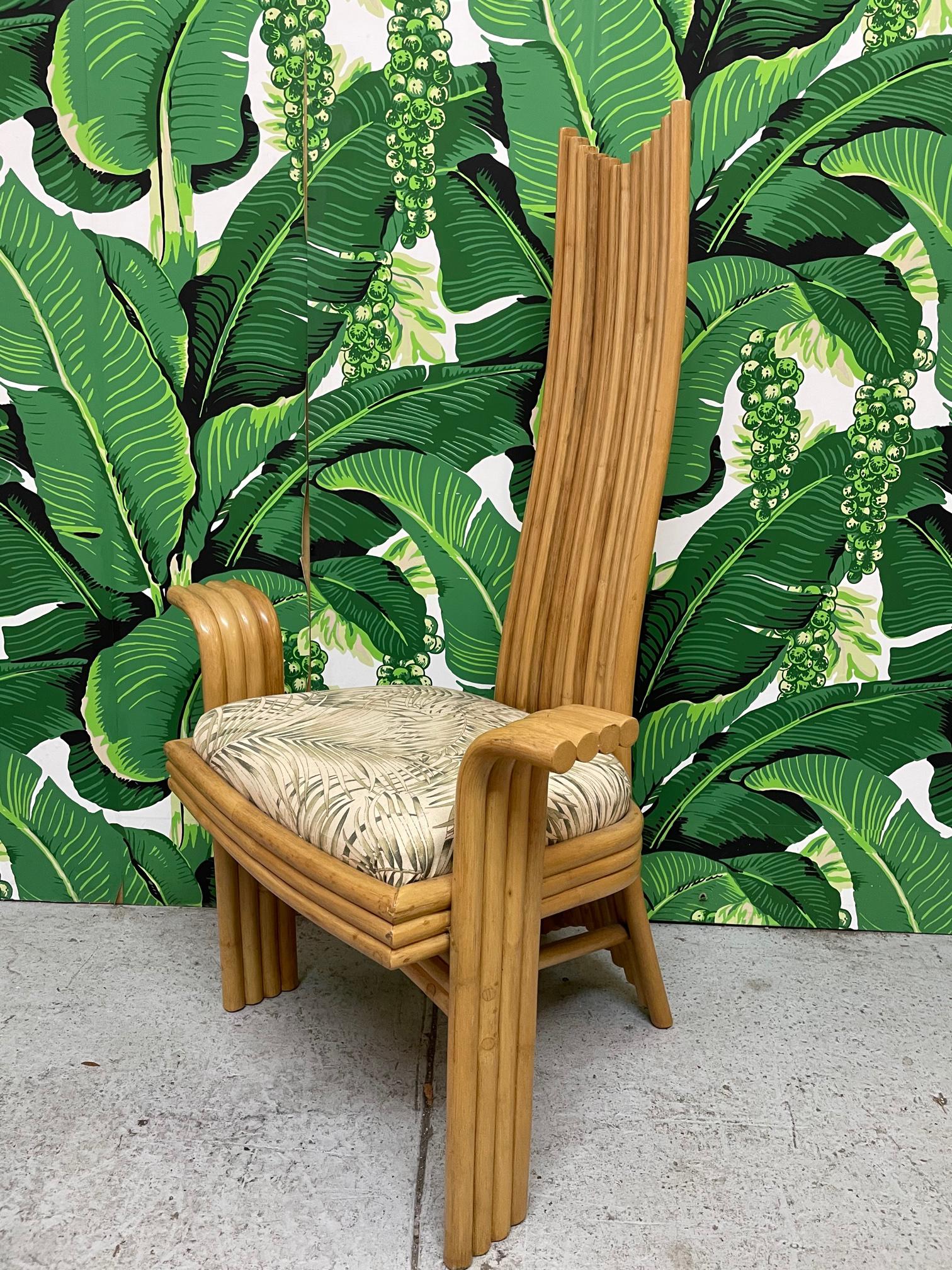 Rare set of six high back rattan dining chairs echoing the styles of Danny Ho Fong or Mackintosh. Unique modern sculptural design with two arm chairs and four side chairs. Makers mark on rear side of chair. Very good condition with minor