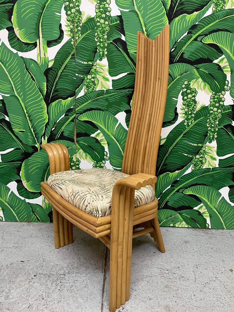 Rare set of six high back rattan dining chairs echoing the styles of Danny Ho Fong or Mackintosh. Unique modern sculptural design with two arm chairs and four side chairs. Makers mark on rear side of chair. Good condition with imperfections