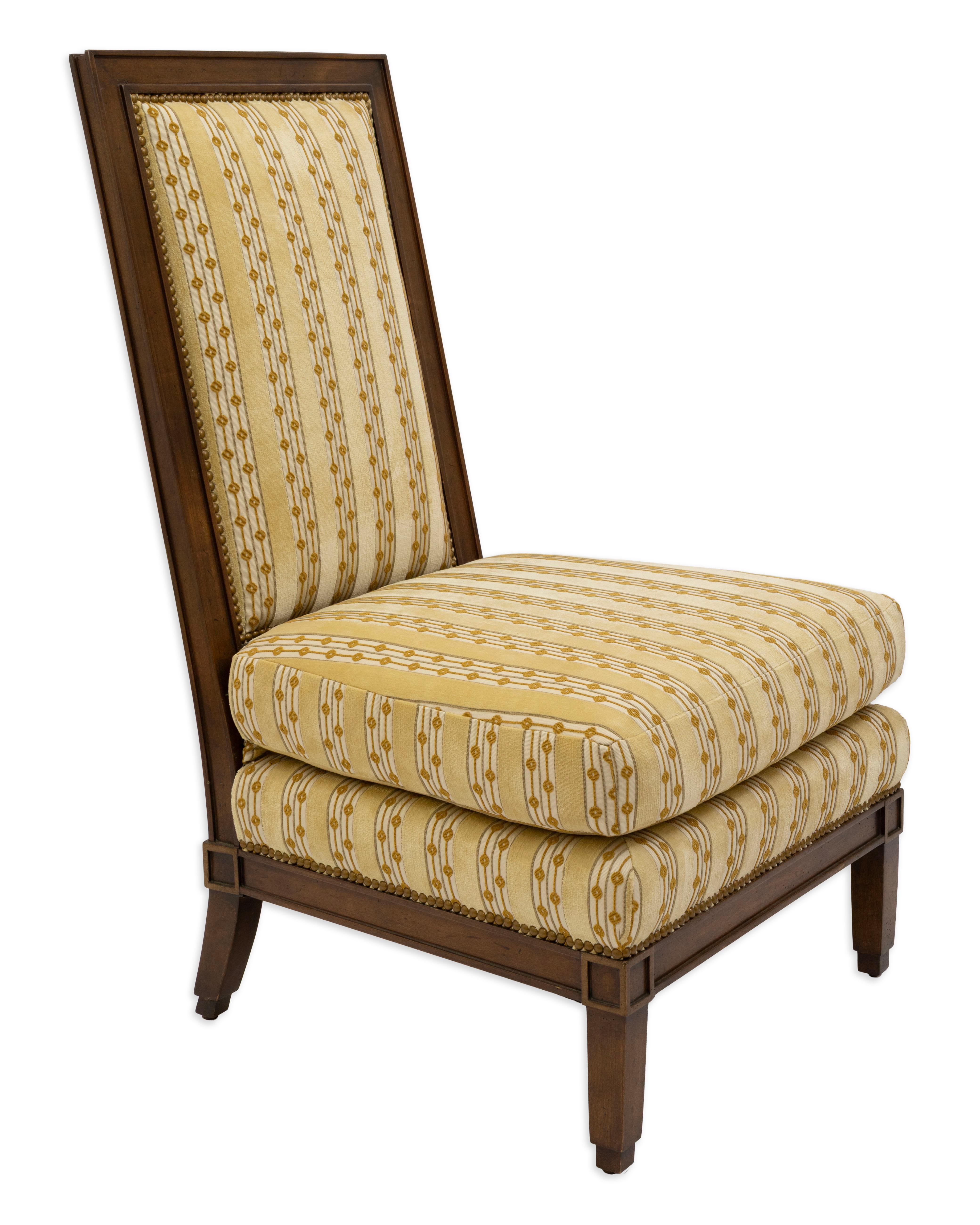 This Baker style accent chair features a tall, gently angled back and a sturdy wooden frame with clean, classic lines. The chair is upholstered in a yellow geometric patterned fabric, combining vertical stripes with small repeating dot motifs for a