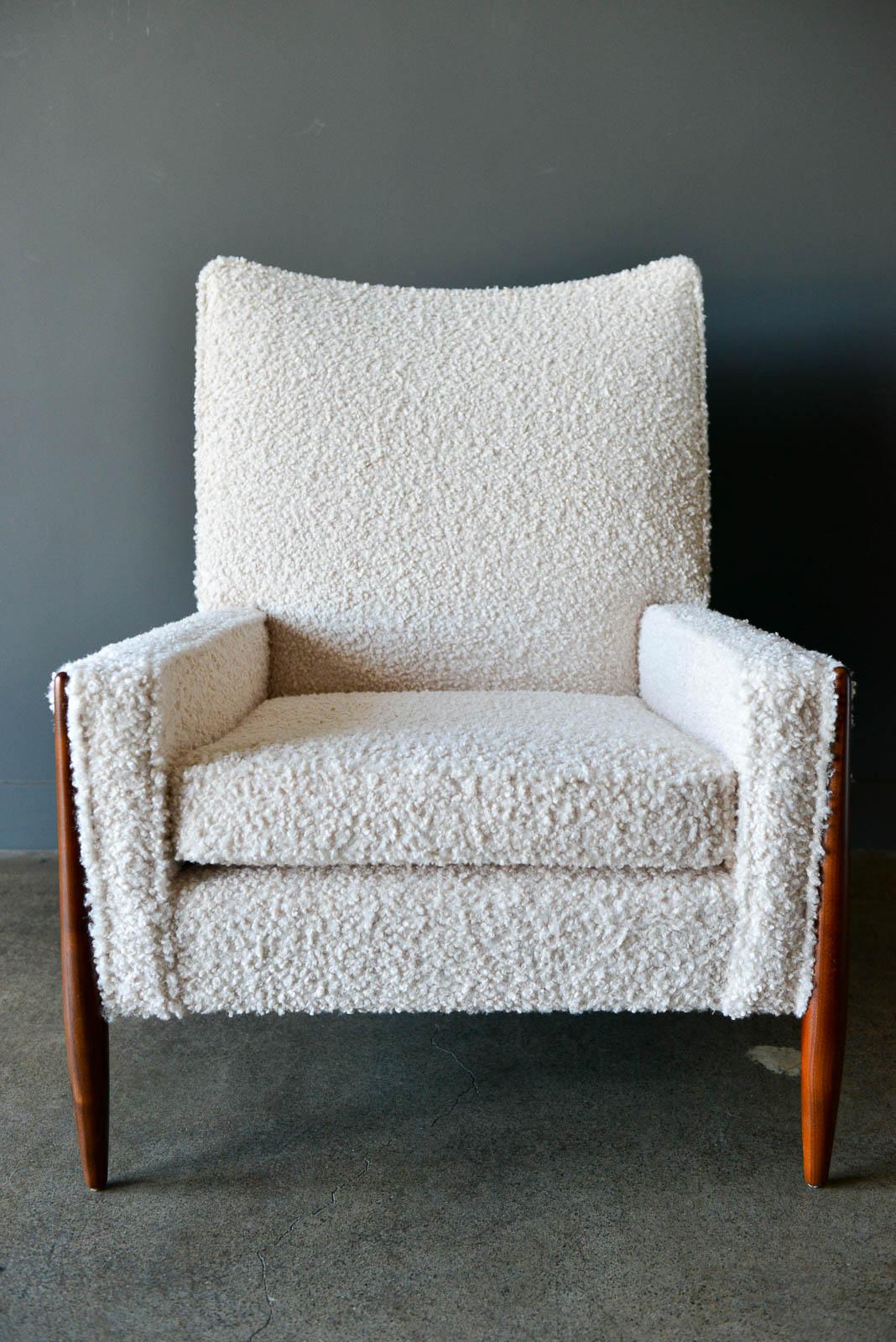 High back walnut frame lounge chair by Jules Heumann, circa 1960. Professionally restored walnut frame and sculpted legs with beautiful soft ivory/cream bouclé fabric. Showroom perfect condition, this is a very comfortable lounge chair that works