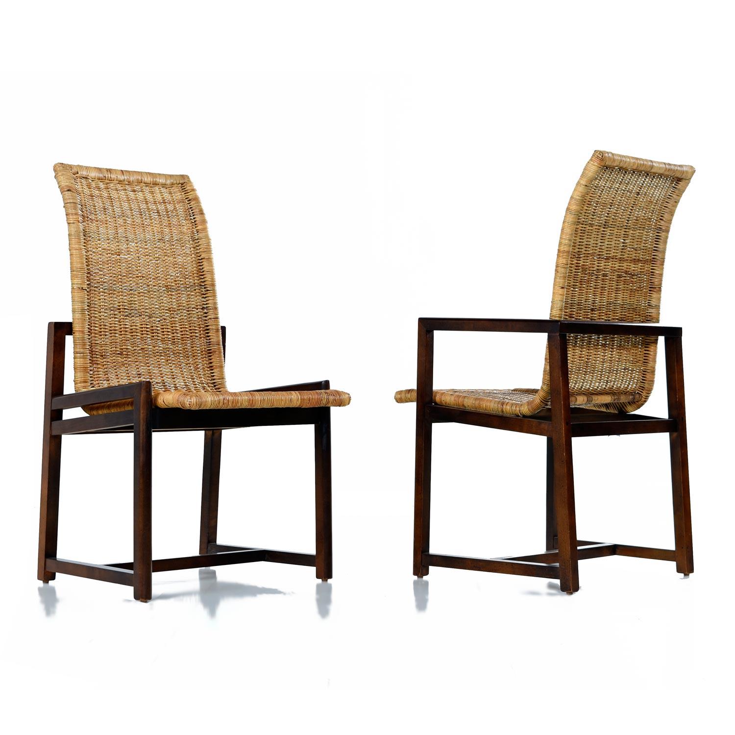 Curvaceous high back bucket seats comprised entirely of woven rattan. The dark toned beechwood frames are a handsome compliment to the woven cane. Although only subtly different, there are two armchairs in this set of six. Made by Century Furniture