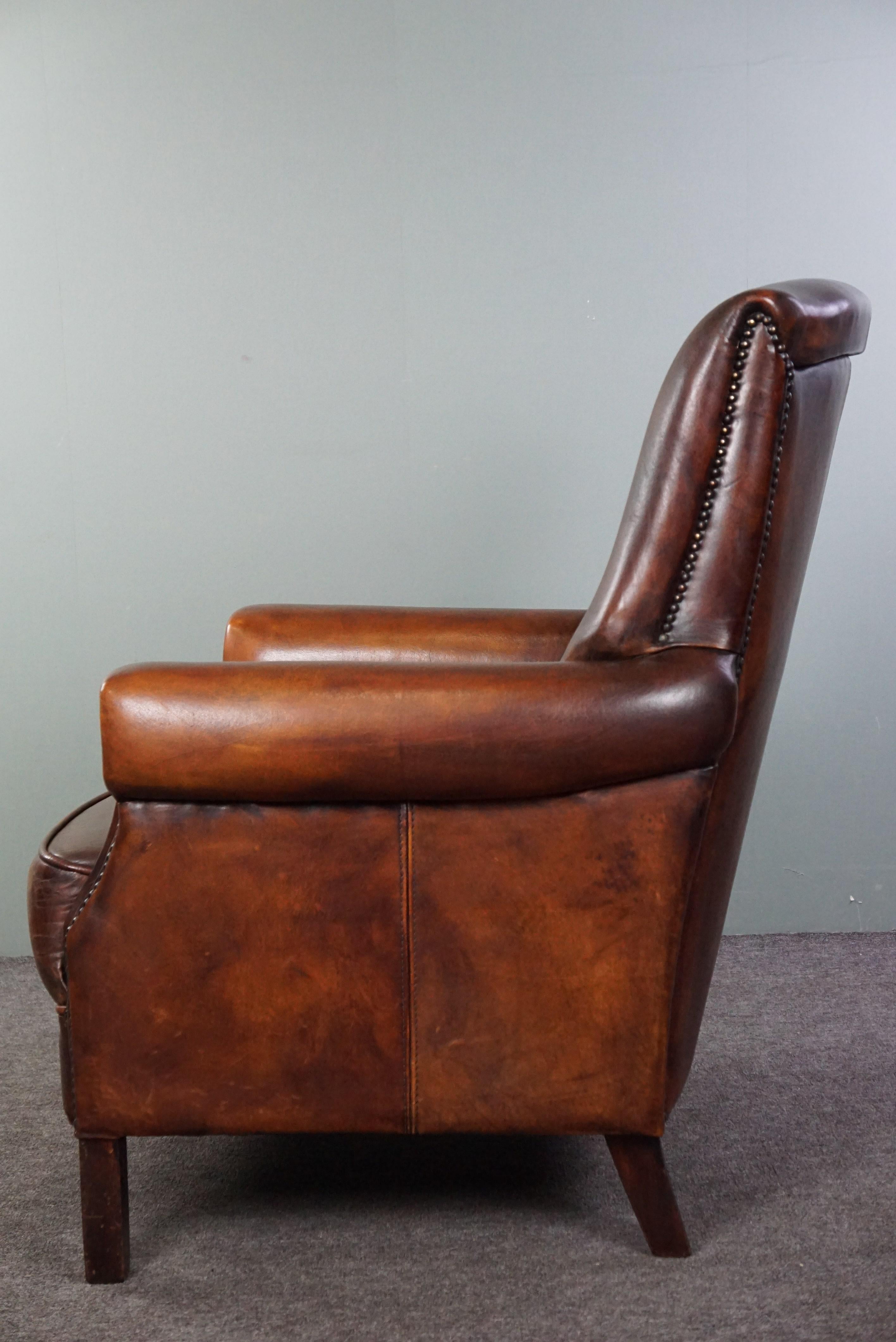 Mid-20th Century High-backed sheep leather armchair in good condition, stunning colors For Sale