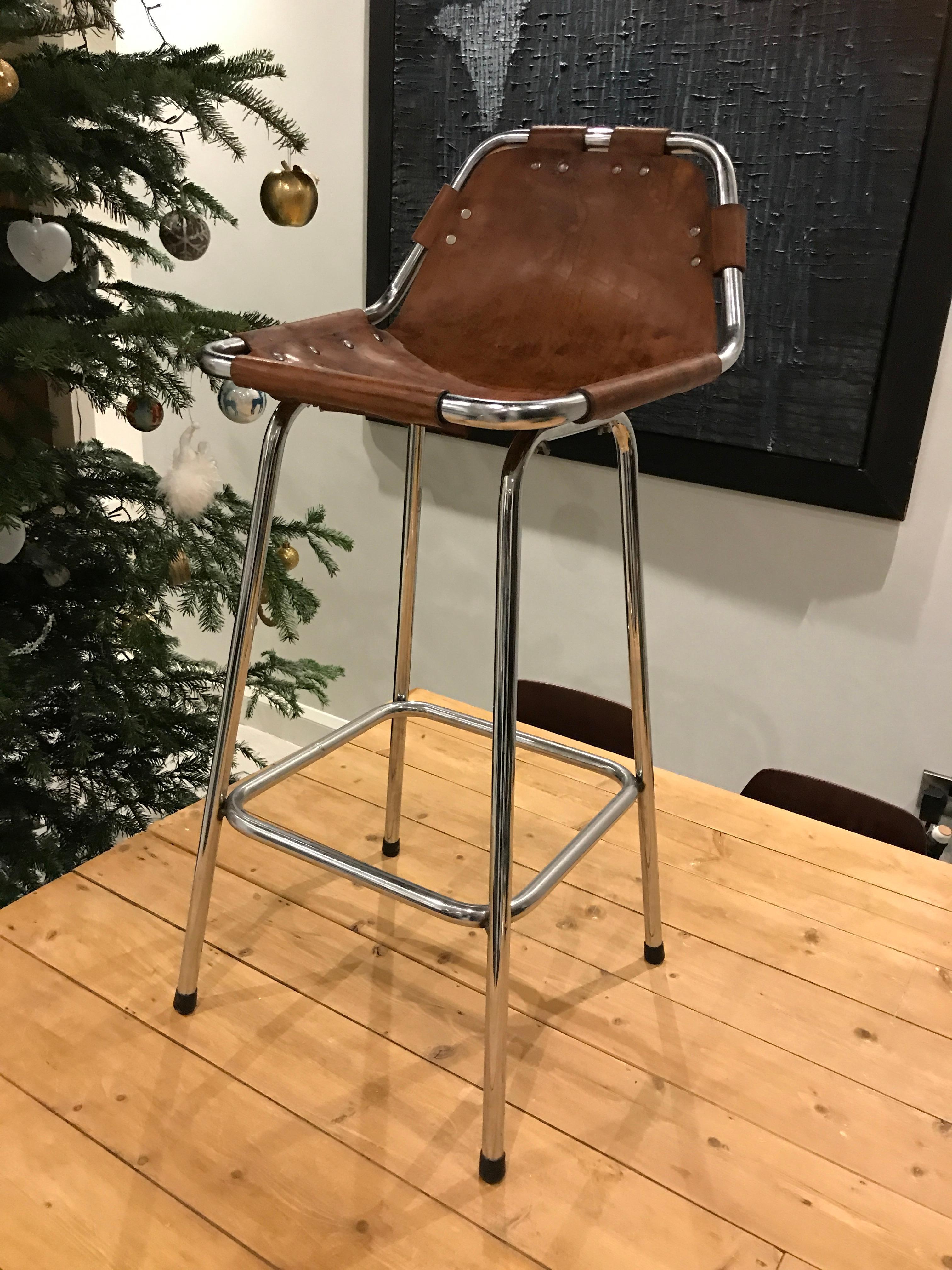Stunning stool, designer Charlotte Perriand used these in the Ski Resort Les Arcs, circa 1960. These stools were commissioned to be made by Cassina, one of the best Italian furniture maker’s, very nice chrome tubular frame with thick leather seat,