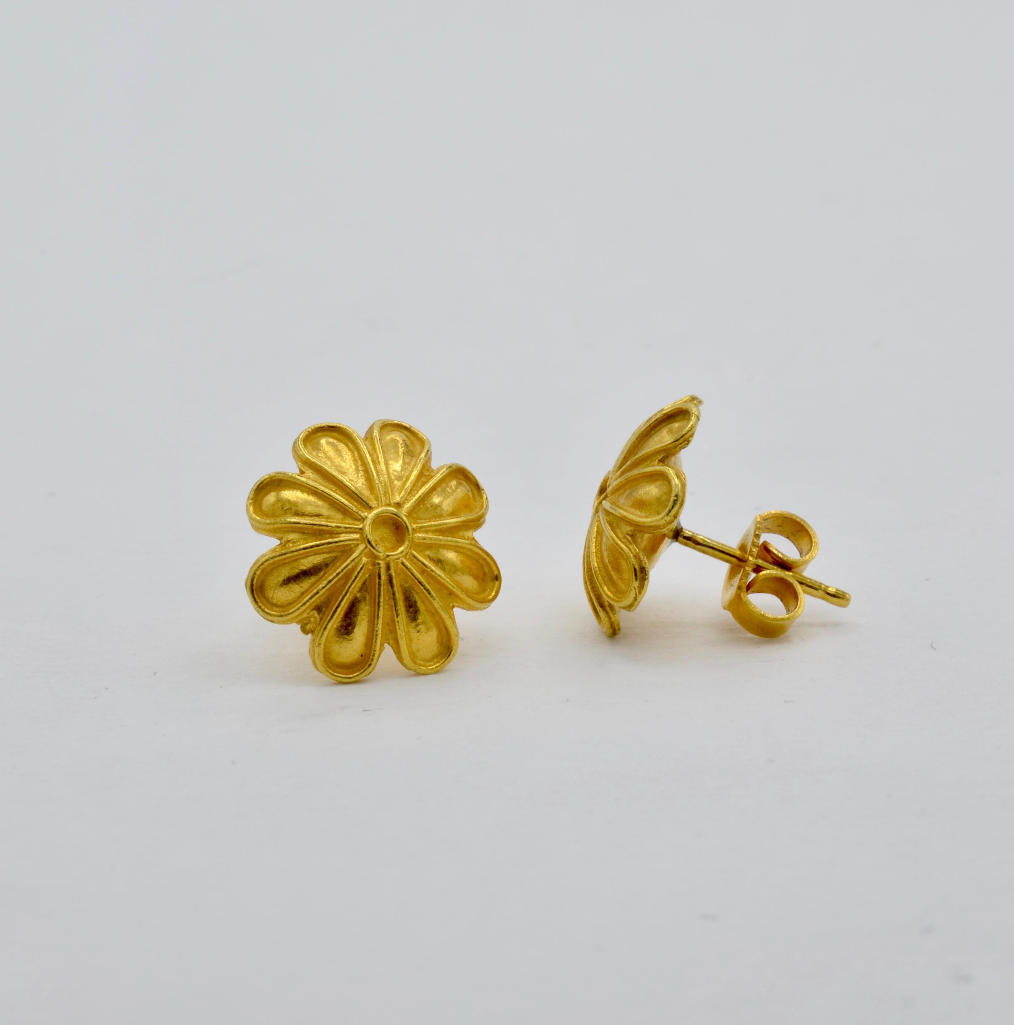 These statement 18K yellow gold flower earrings are a beautiful museum reproduction curated for your personal collection. The bright yellow of the high carat gold creates a regal fashion timeless throughout the centuries and fit for a queen. 