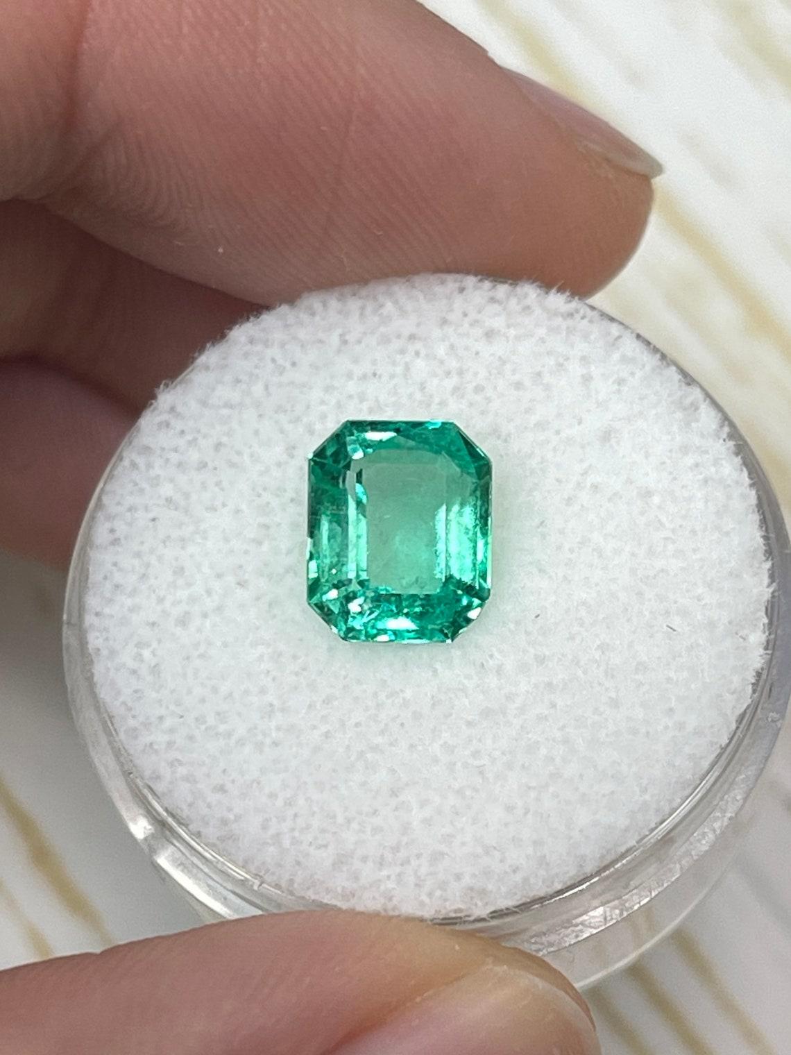 Stone: Emerald
Weight: 2.14-carats
Shape: Emerald Cut
Clarity: Transparent
Luster: Excellent/Very Good
Color: Yellowish Muzo Green
Measurements: 8.78mm x 7.20mm x 4.92mm
Geographic Origin: Colombia
Treatment: Natural, Oiling

Comments: Due to their