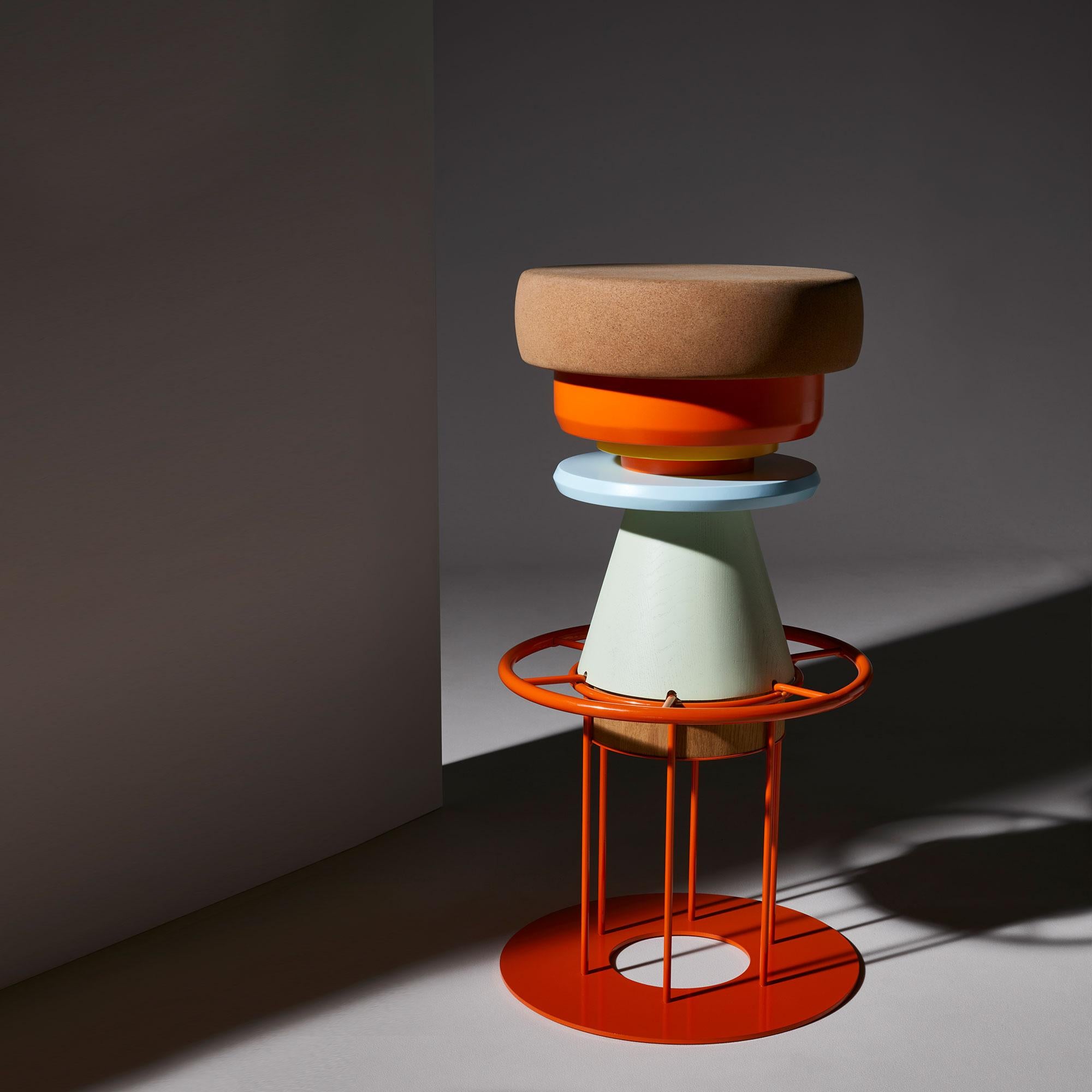 High Colorful tembo stool - Note Design Studio
Dimensions: D 36 x H 76 cm
Materials: Lacquered steel structure, solid wood (beech) and lacquered MDF, natural cork base.
Available in black and 3 sizes: H46, H64, H76 cm.

Tembo is a stool made of