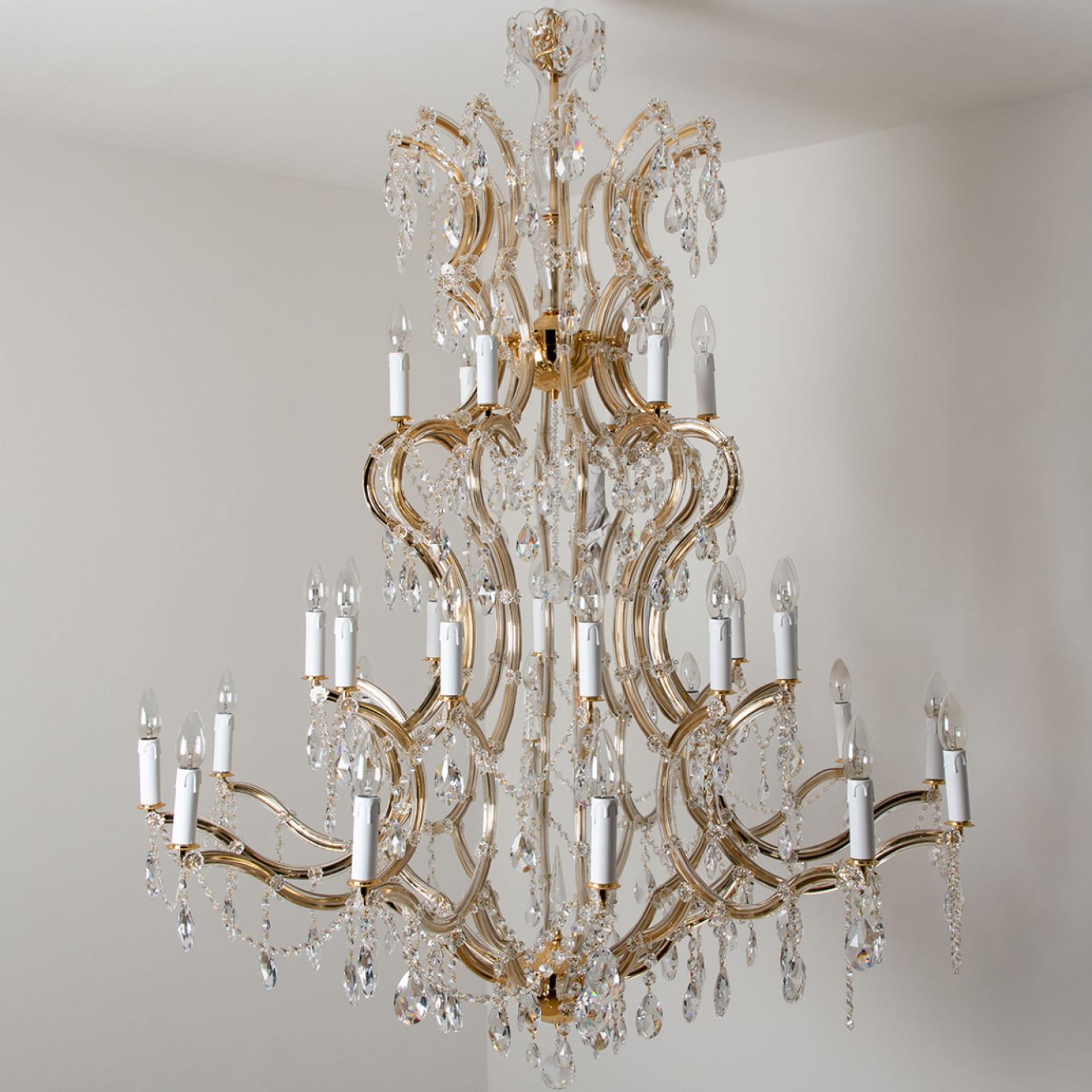 This stunning large high-end chandelier. Bring the passion of the Palace of Versailles into your home with this ageless classic. The Maria Theresa has been the gold standard for elegance and grace in the chandelier world for hundreds of years. This