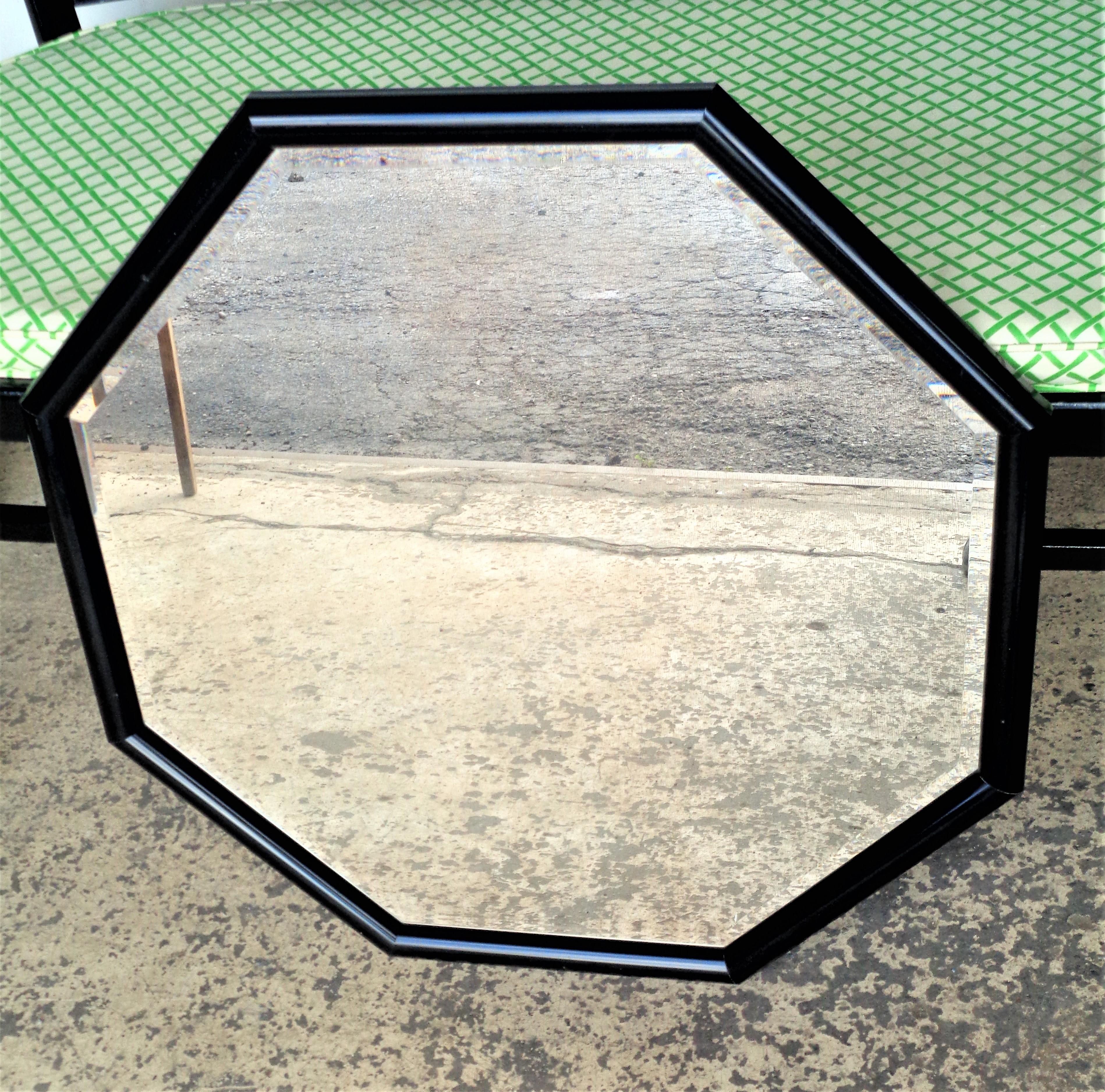High gloss black acrylic coated minimalist designed octagonal framed beveled glass wall mirror, circa 1970's. Look at all pictures and read condition report in comment section.