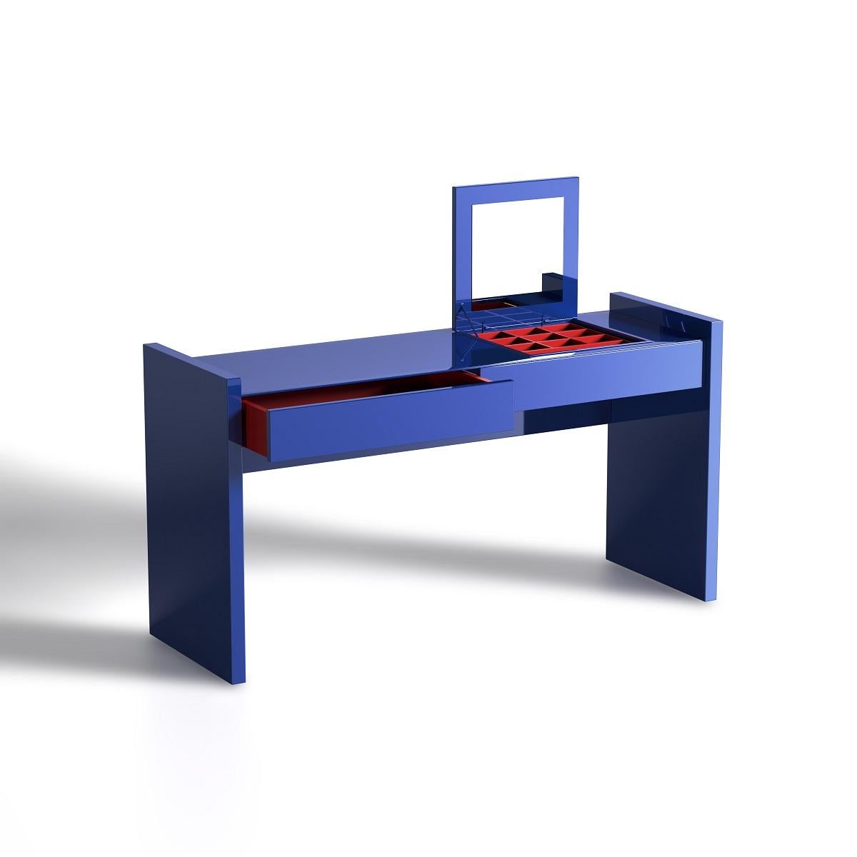 The High-Gloss Electric Blue Lacquer Dressing Table is a statement piece that combines modern sophistication with functional elegance. Featuring a striking electric blue lacquer finish that radiates vibrancy, this dressing table is further elevated