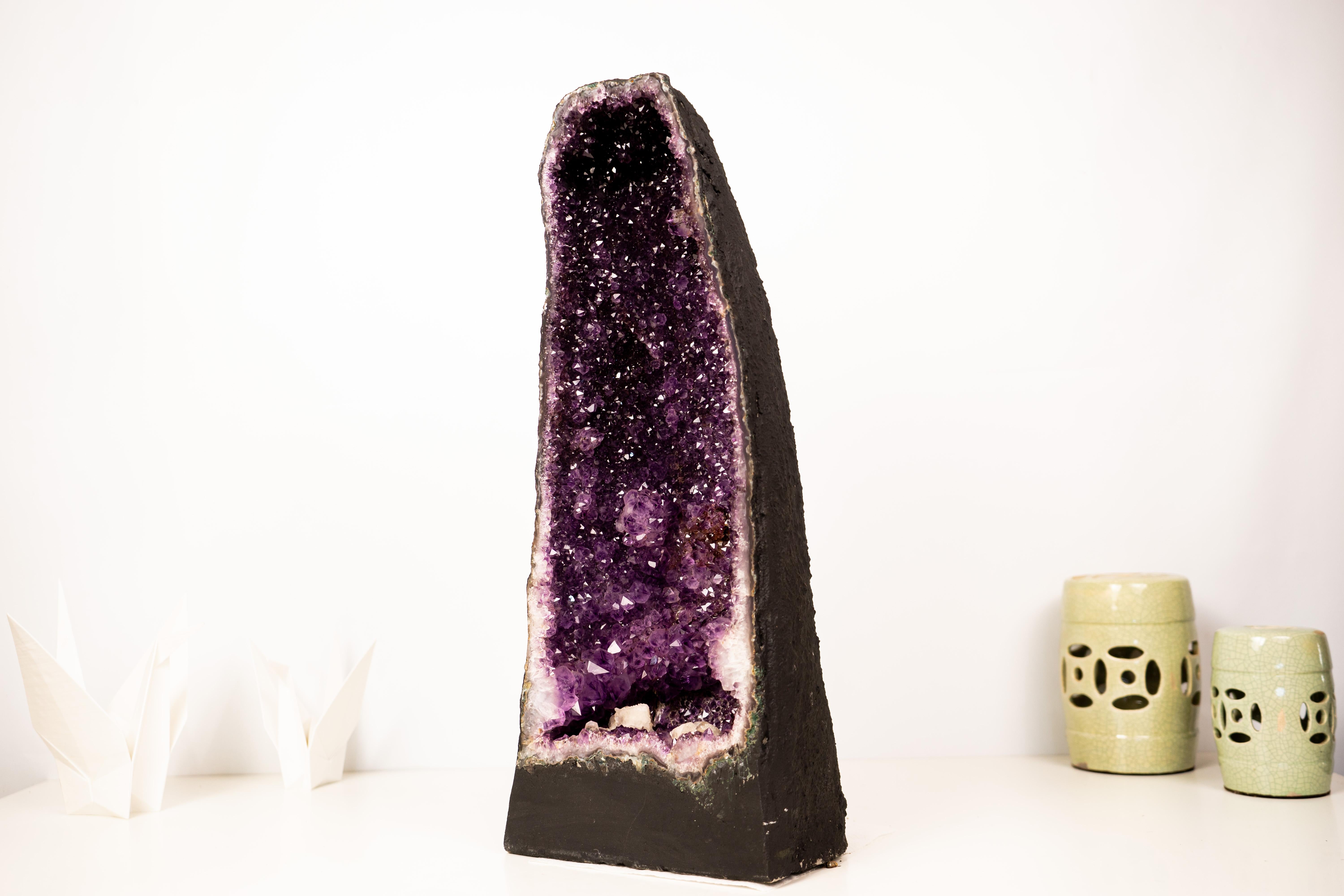 A Gorgeous, High-Grade Galaxy Amethyst Geode with Rare Inclusions

▫️ Description

Magnificent, rare and colorful, this Amethyst Geode features a stunning multi-colored, deep purple Amethyst crystals on a perfectly cathedral shape geode. Imagine