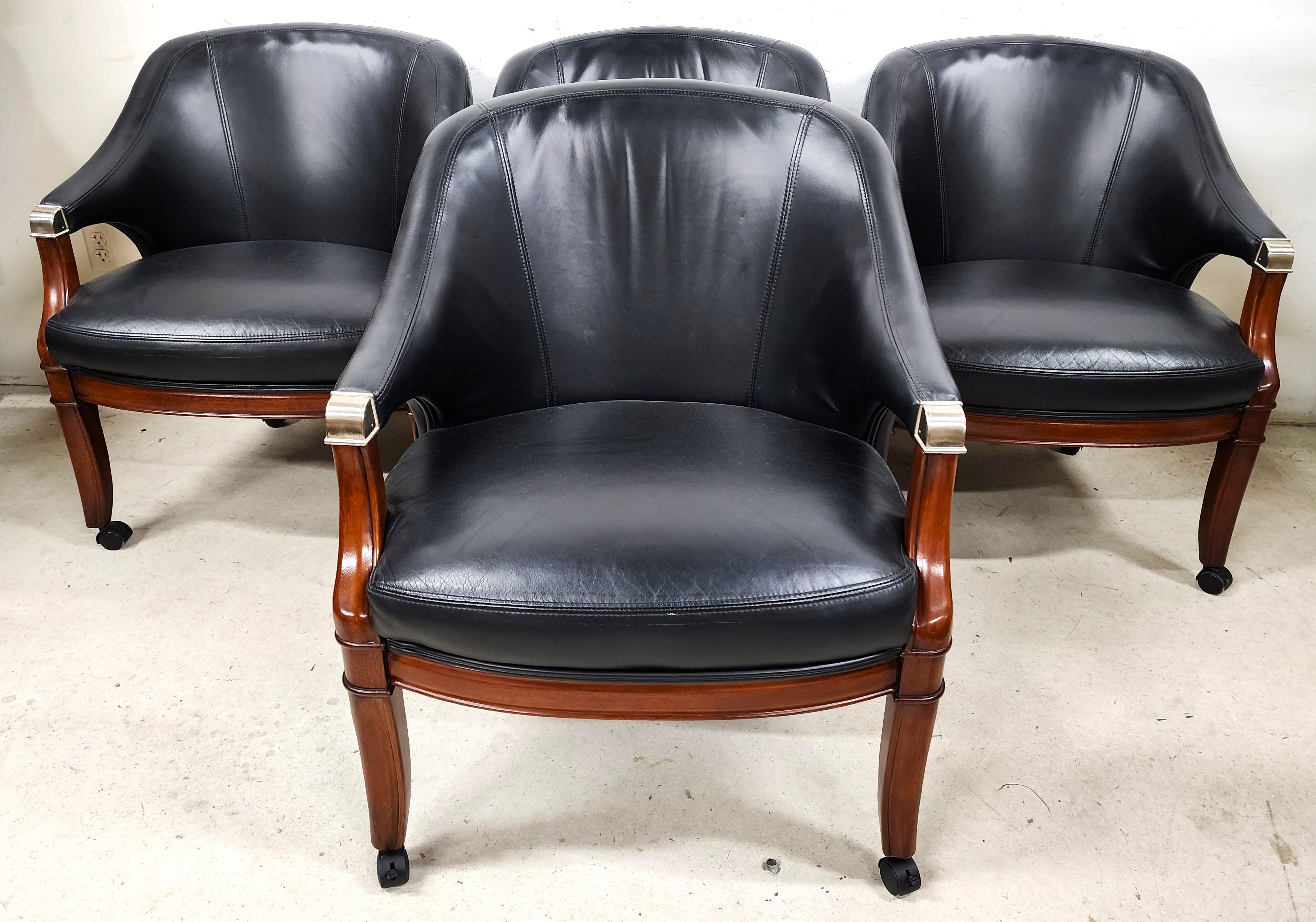 For FULL item description click on CONTINUE READING at the bottom of this page.

Offering One Of Our Recent Palm Beach Estate Fine Furniture Acquisitions Of A
Set of 4 High-Grade Leather Dining Game Rolling Armchairs by THOMASVILLE

Approximate