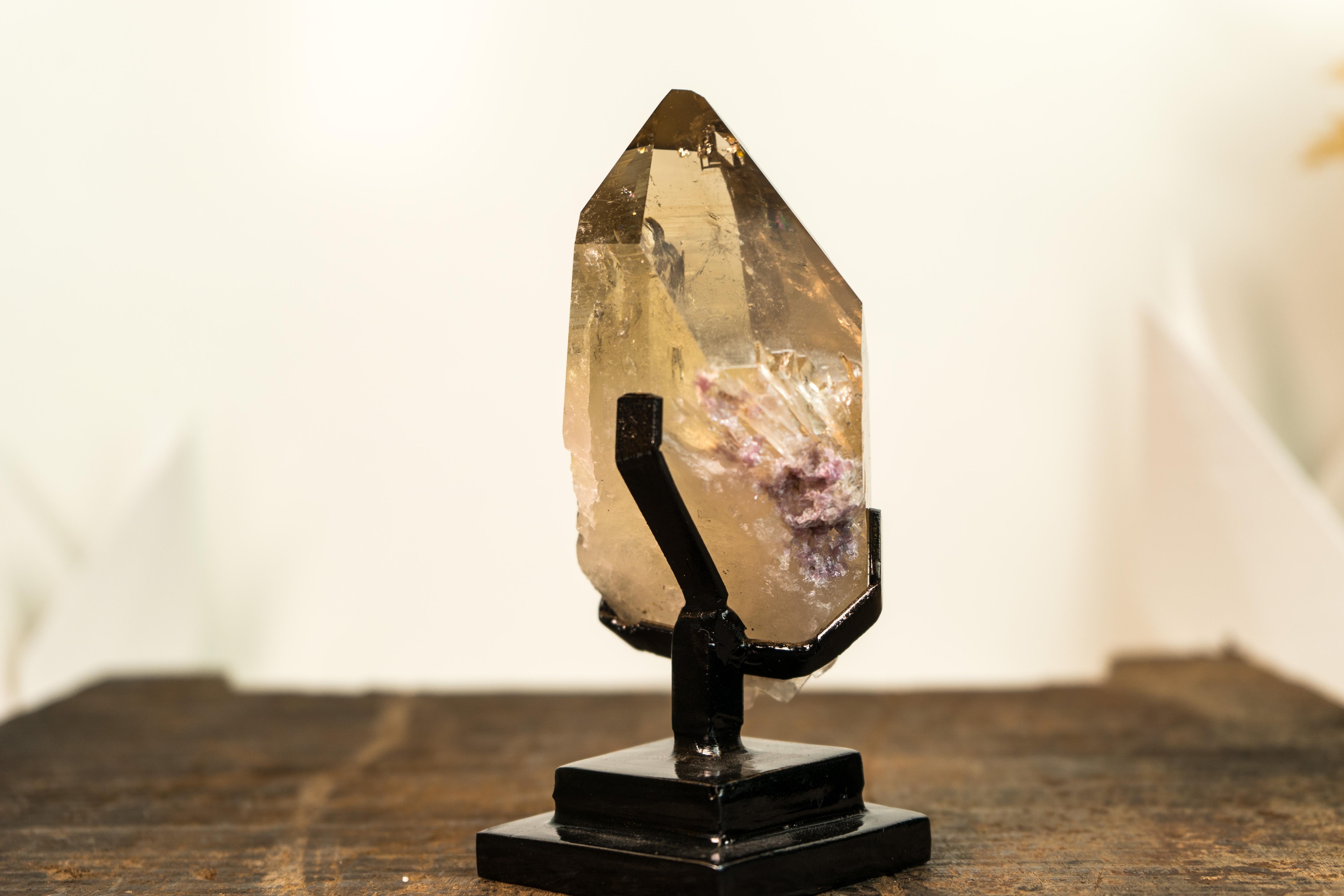 Beautifully formed and showcasing one of the rarest and most sought-after colors, Golden Yellow Citrine, this natural Citrine represents the pinnacle of crystal beauty and rarity. This masterpiece is sure to be an extraordinary addition to any