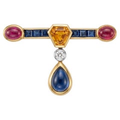 High Jewelry Brooch with Ruby Cabochons, Sapphires, and Brilliant-Cut Diamond