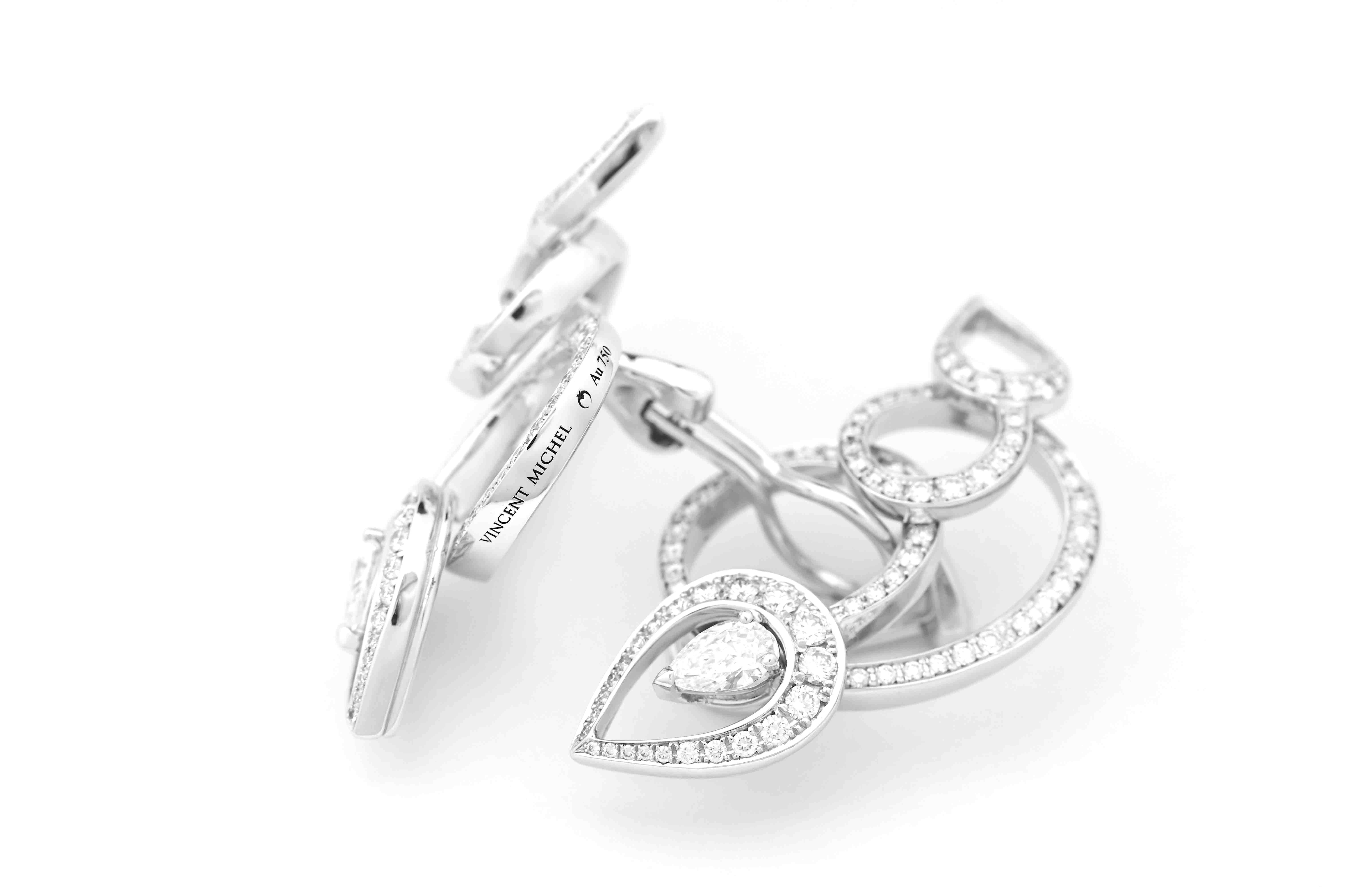 Earrings with clip system, (addition of posts on request) in 750 white gold set with 204 natural brilliant-cut diamonds (superior quality DEF/IF-VVS), and two natural drop-cut diamonds (2x 0.31ct/each) of superior quality EF/IF-VVS.

These earrings