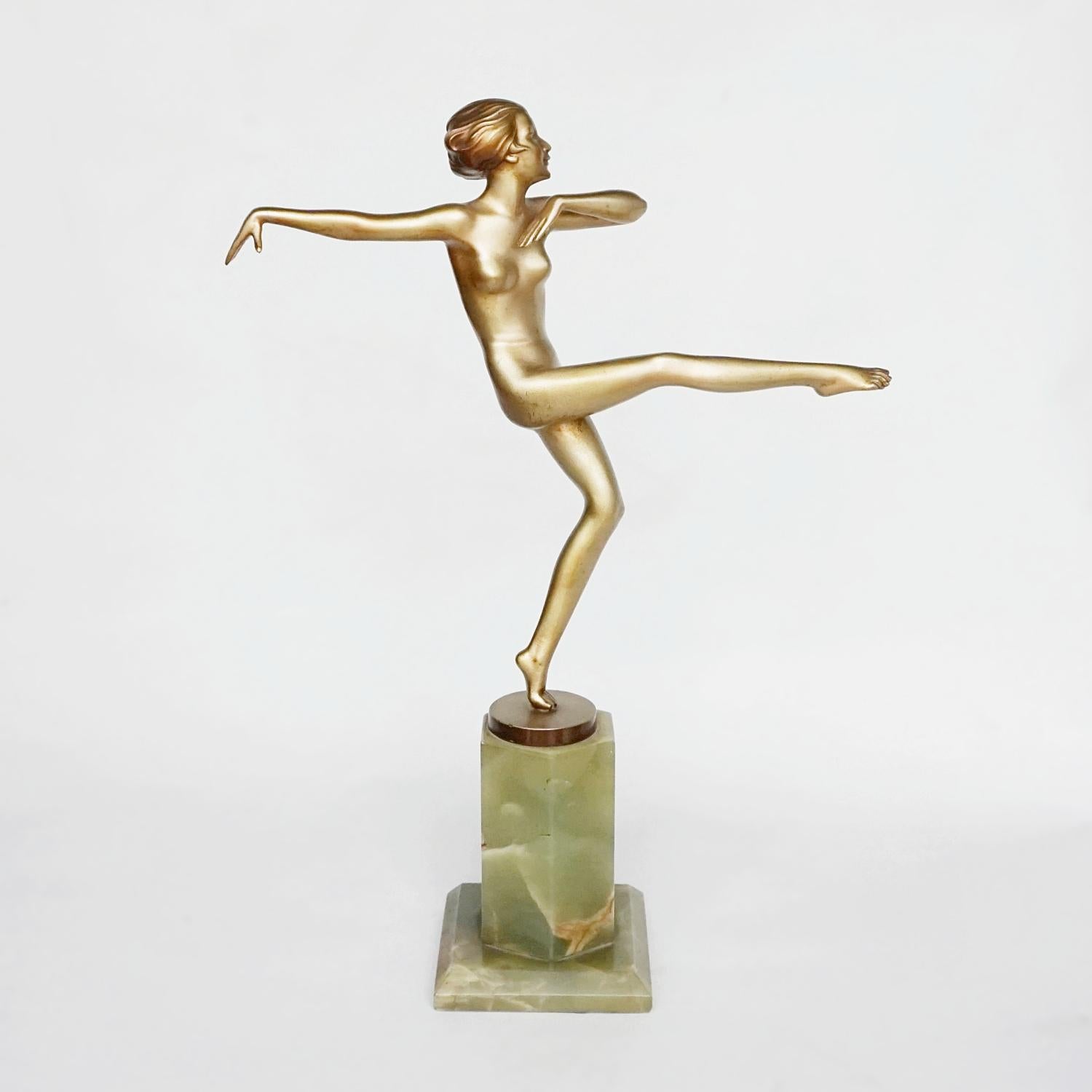'High Kick' an Art Deco cold painted bronze sculpture by Josef Lorenzl. Set over an original onyx base, the sculpture shows an elegant lady in motion with her arms and leg outstretched. 

Fine orignal condition, wear consistent with age and use.