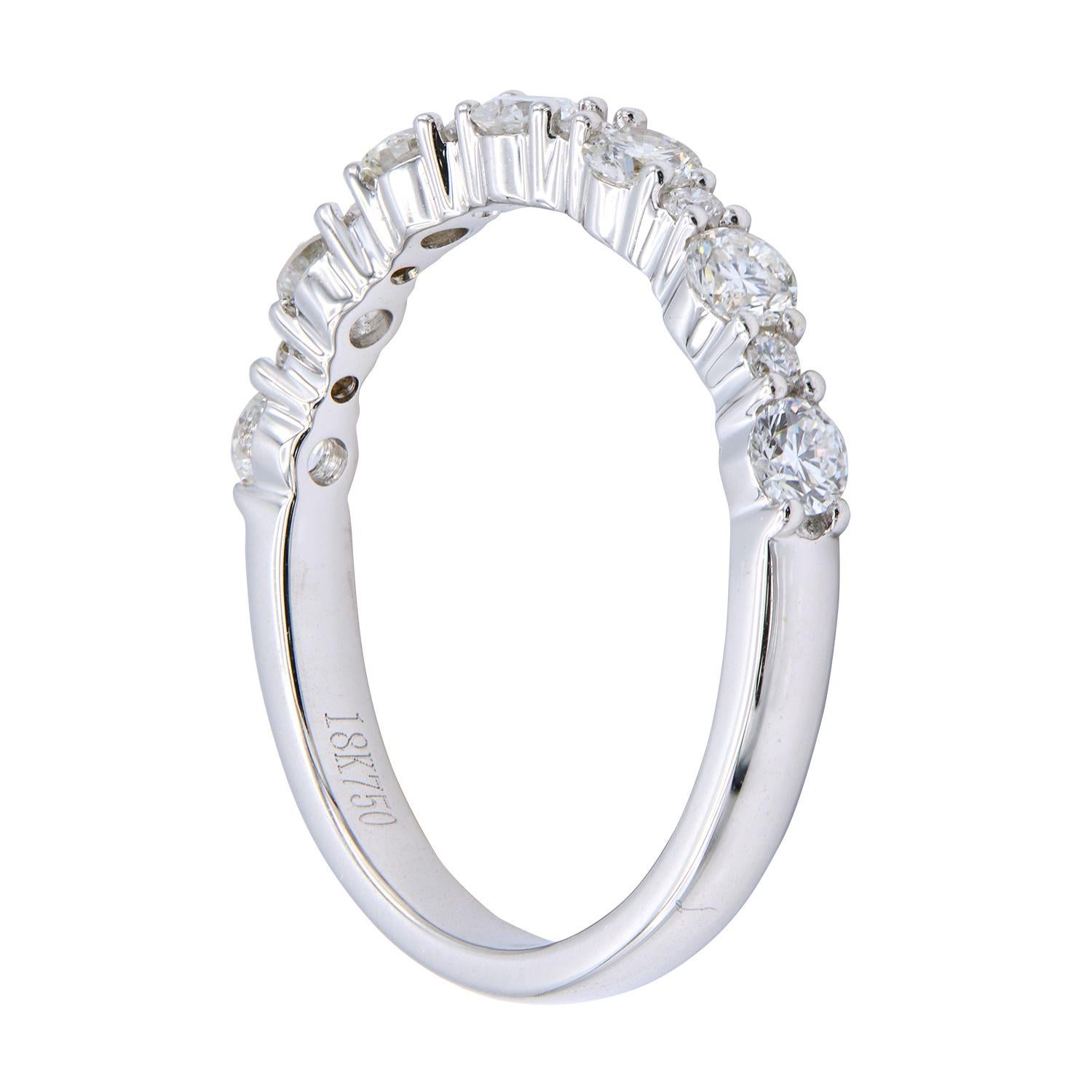 This classic diamond band adds a little twist by alternating between 2 size diamonds. Each band is made of 13 round VS2, G color diamonds totaling 0.69 carats which are set in 2.7 grams of 18 karat white gold. This ring is size 6.5 