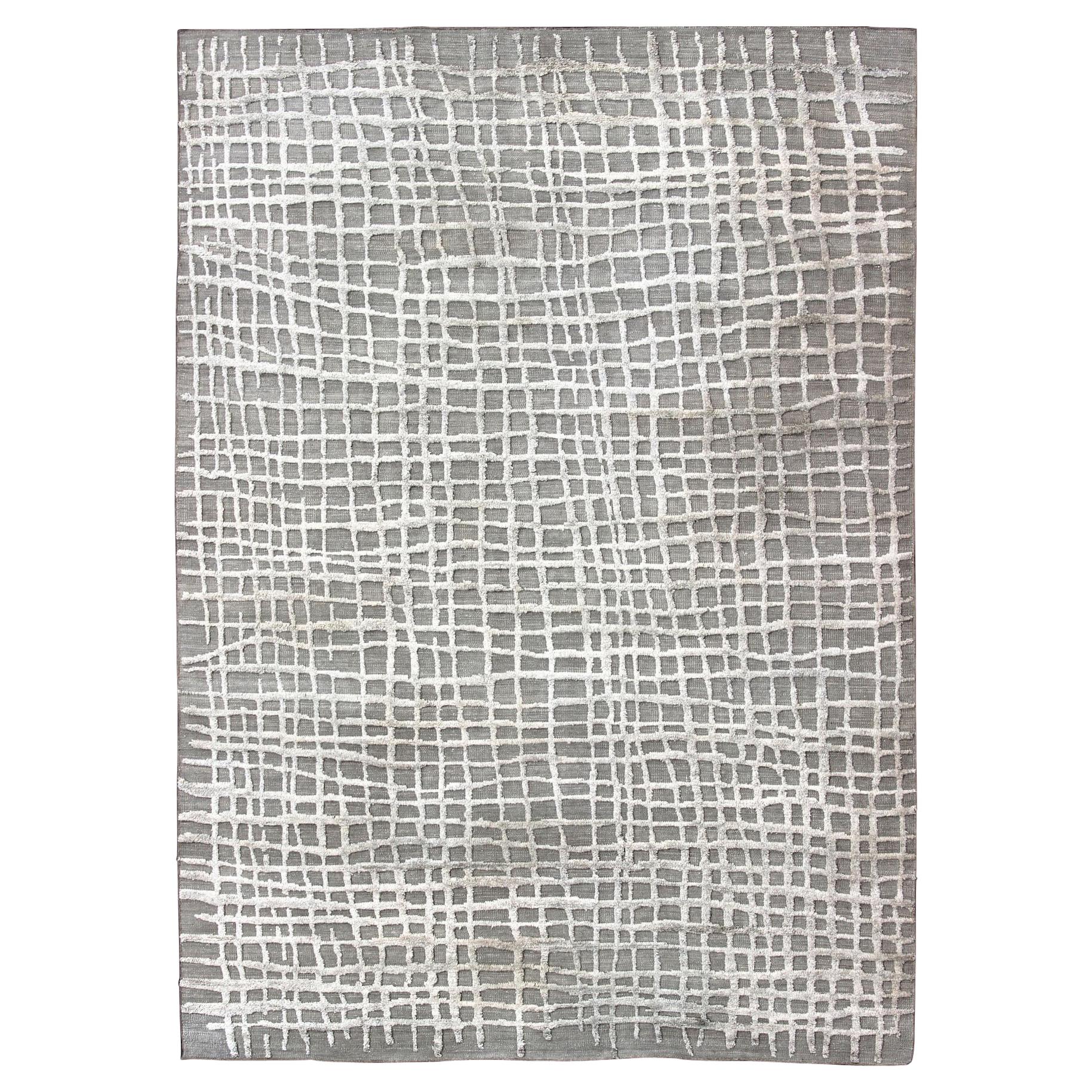 Grand tapis moderne à texture très forte dans un design minimaliste avec des motifs taupe et blanc