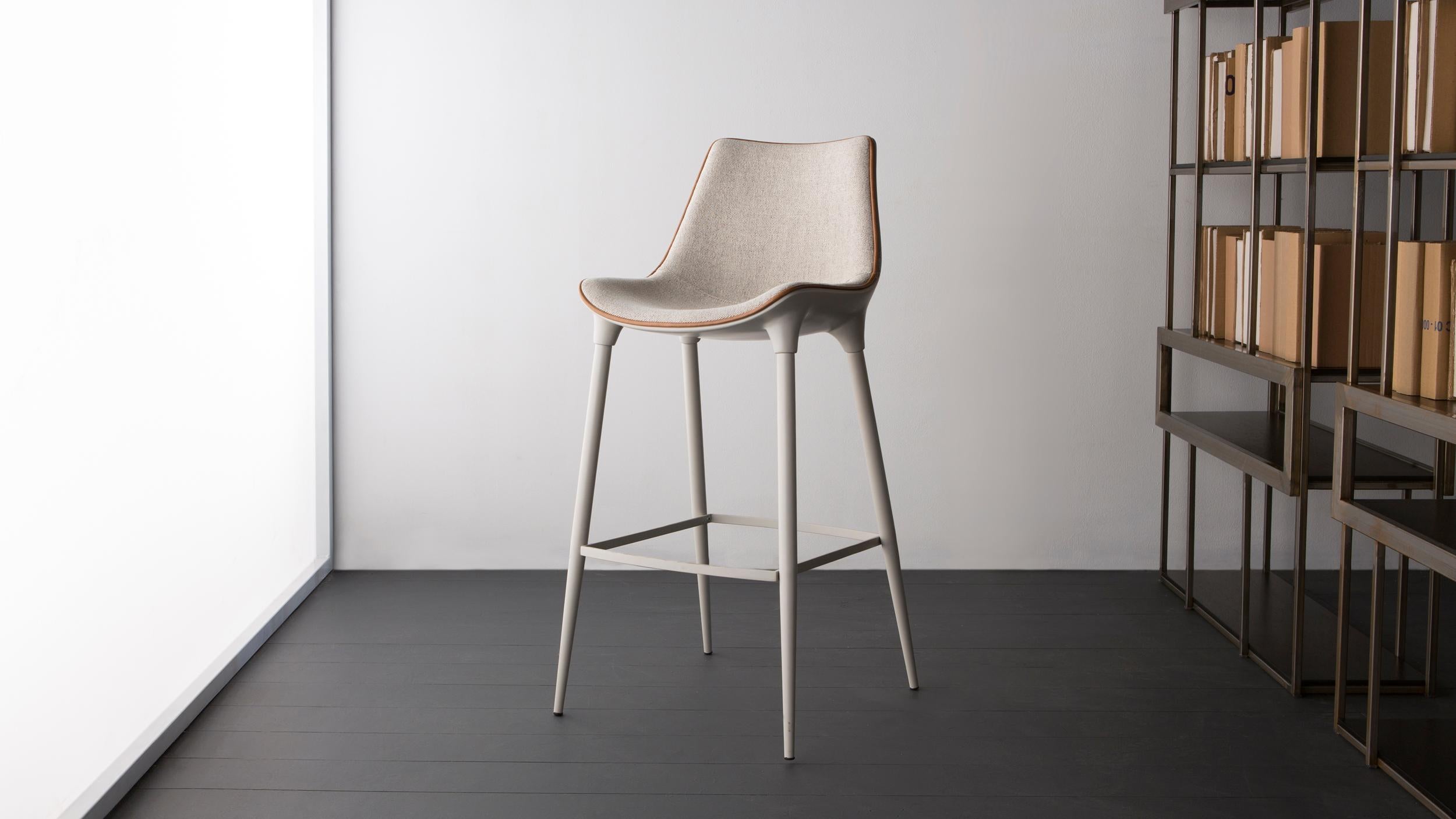 High Luna Bar Stool by Doimo Brasil
Dimensions: W 51 x D 53 x H 106 cm 
Materials: Paint, Fabric.

Also available in W 51 x D 53 x H 90 cm, Seat Height: 60 cm. 

With the intention of providing good taste and personality, Doimo deciphers trends and