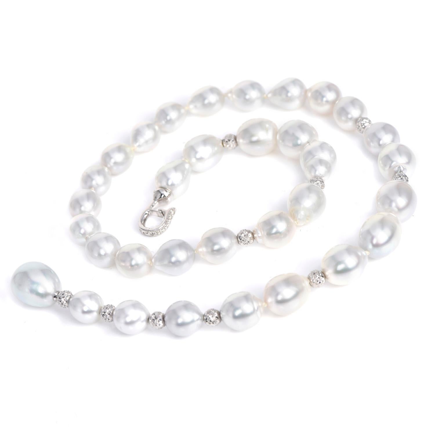 High Luster Metallic Gray Semi Baroque Pearls Adorning a strand of 18K Gold Beads with an adjustable Clasp.

Its clasp has (7) Round Cut Genuine Diamonds, prong-set, weighing approximately 0.12 carats, H-I  Color & VS Clarity.

this piece is formed