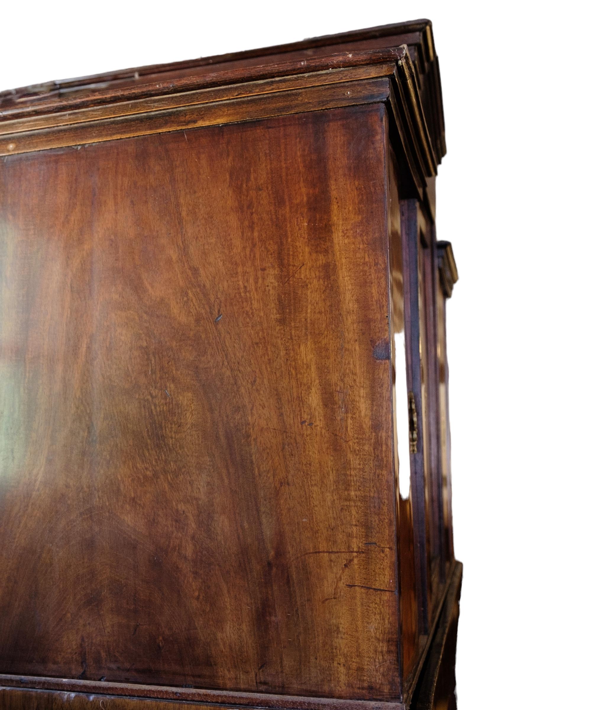 High mahogany secretary with marquetry and brass fittings from around the 1840s.
Measurements in cm: H:215 W:104 D:52