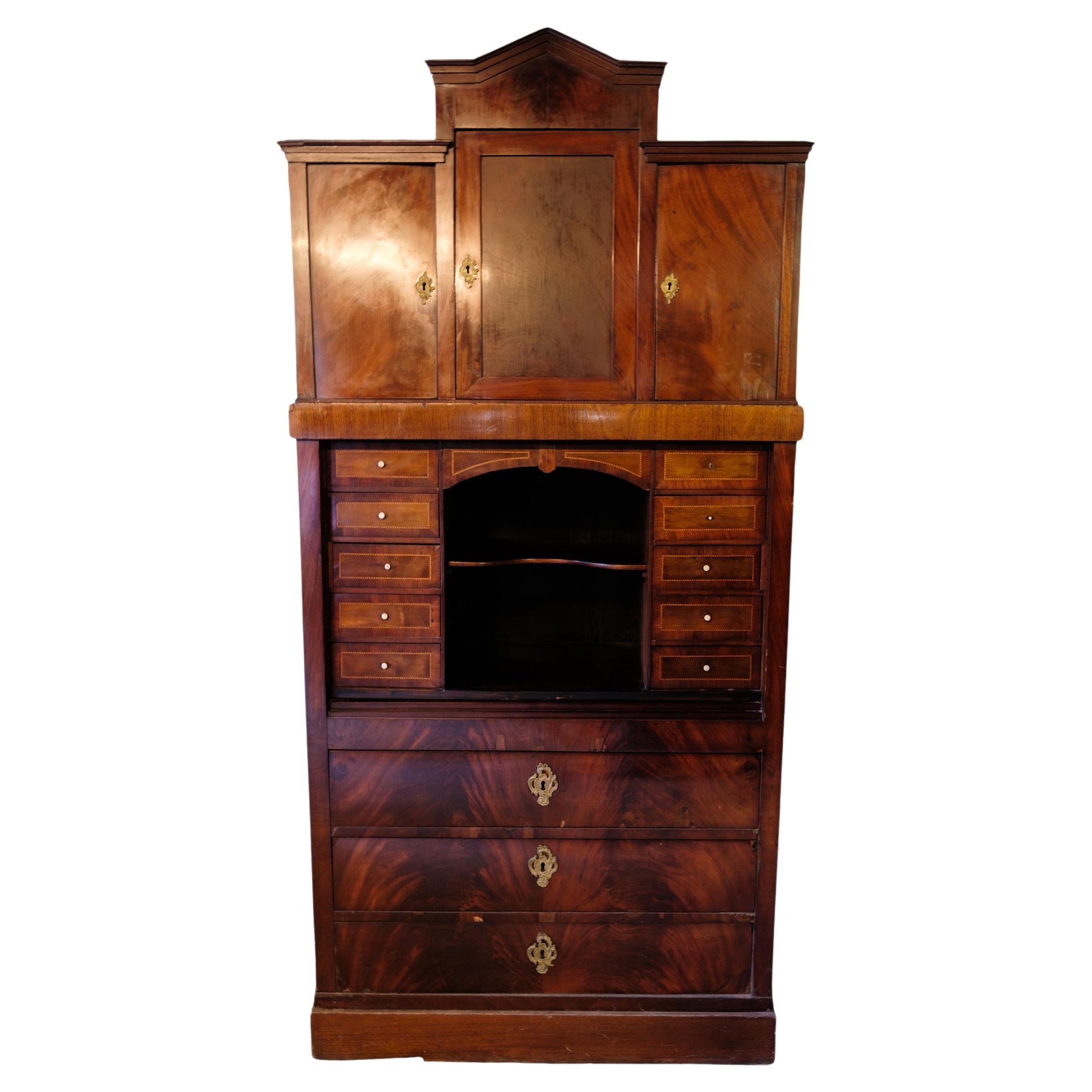 High mahogany secretary with marquetry and brass fittings from around the 1840s For Sale