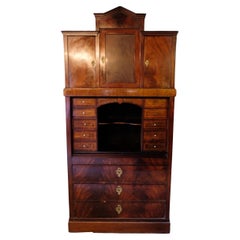 Antique High mahogany secretary with marquetry and brass fittings from around the 1840s