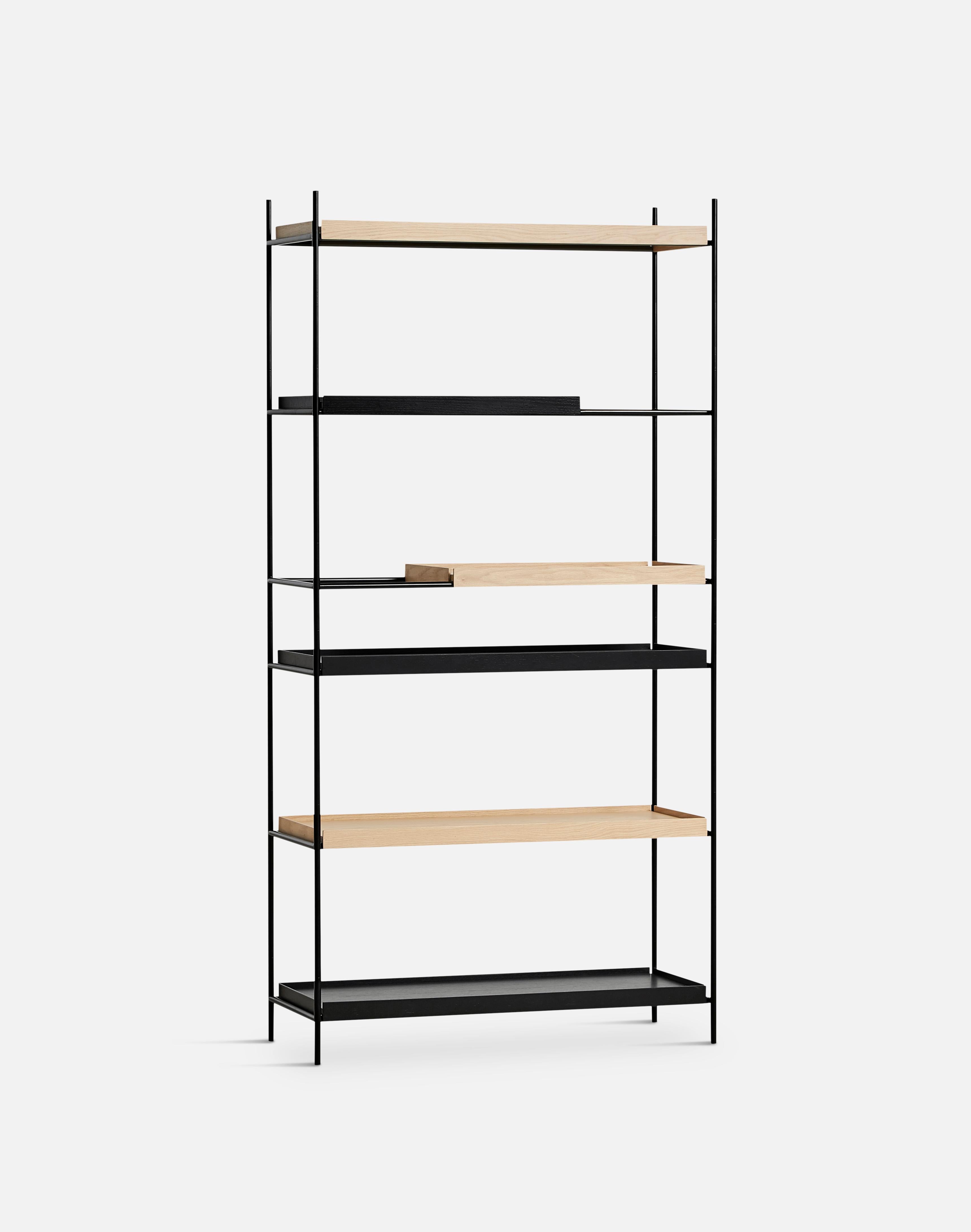 High oak and black tray shelf I by Hanne Willmann
Materials: metal, oak.
Dimensions: D 40 x W 100 x H 201 cm
Also available in different tray conbinations and 2 sizes: H 81, H 201 cm.

Hanne Willmann is a dynamic German designer with her own