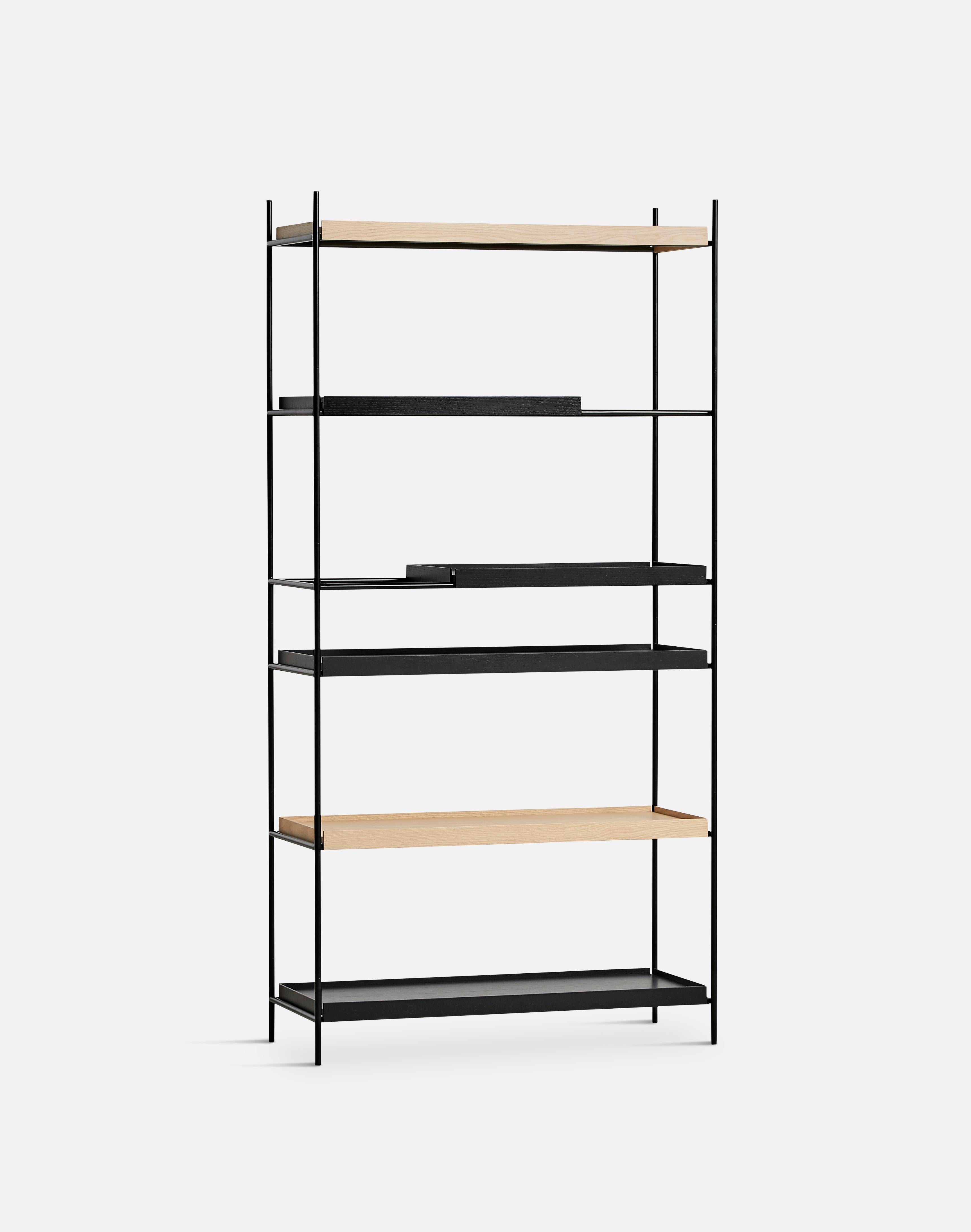 High Oak and black tray shelf II by Hanne Willmann
Materials: Metal, oak.
Dimensions: D 40 x W 100 x H 201 cm
Also available in different tray combinations and 2 sizes: H81, H 201 cm.

Hanne Willmann is a dynamic German designer with her own