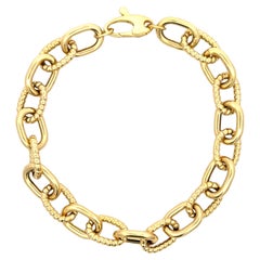 Bracciale a maglie ovali con motivo a torsione e lucidatura alta 8,08 grammi in oro giallo 14 carati