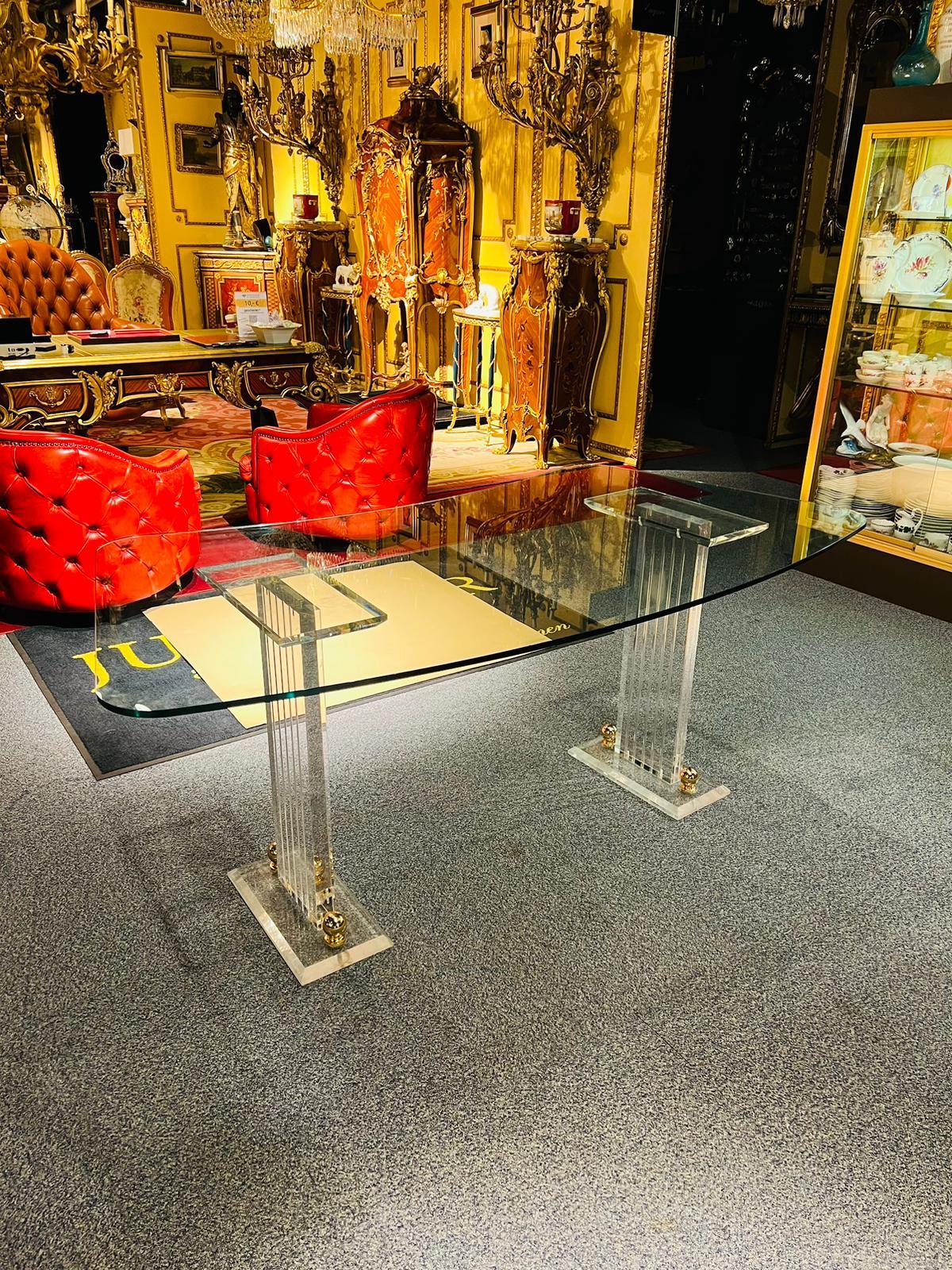 High quality acrylic desk stands on2 acrylic columns / Pillars with beautiful shape and gold accessories on the feet. The glass top is removable and a bit curved

Made in Italy.
