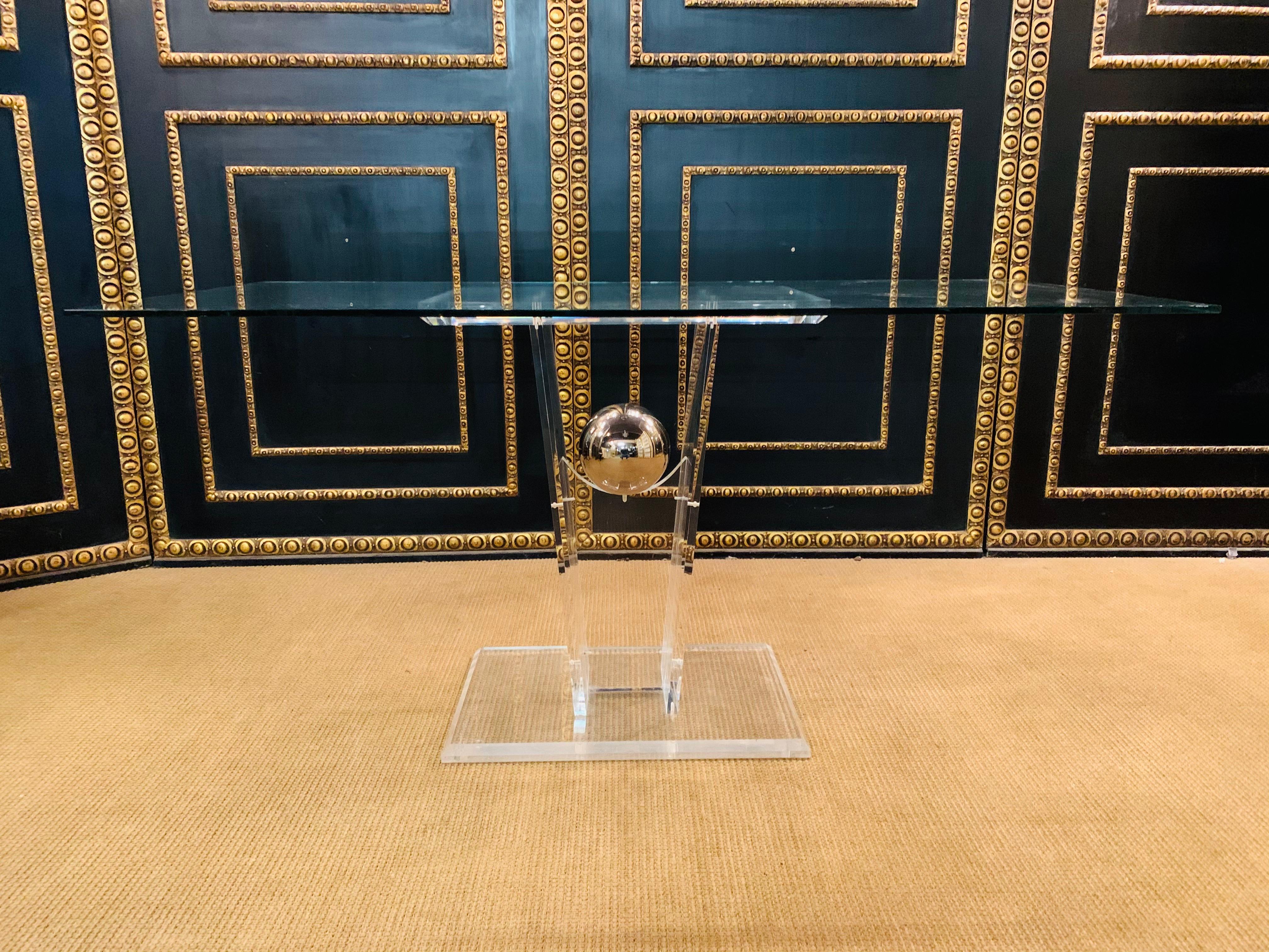 Made of solid acrylic in the middle is a ball of silver. Absolute design classic.