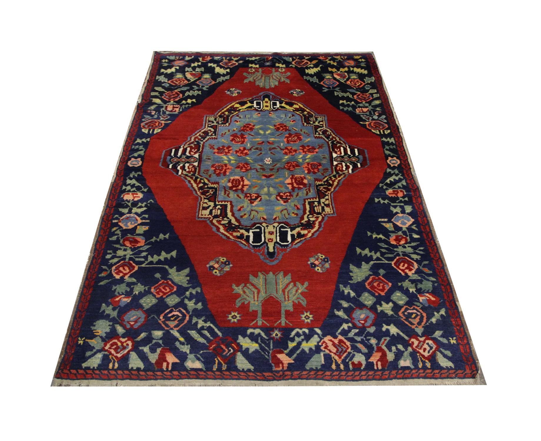 An oriental rug with beautiful blue pool fills the central medallion with floating roses. This handmade carpet is enclosed by a deep red background and further floral motifs through the border.
This high-quality Karabagh rug is perfect for both