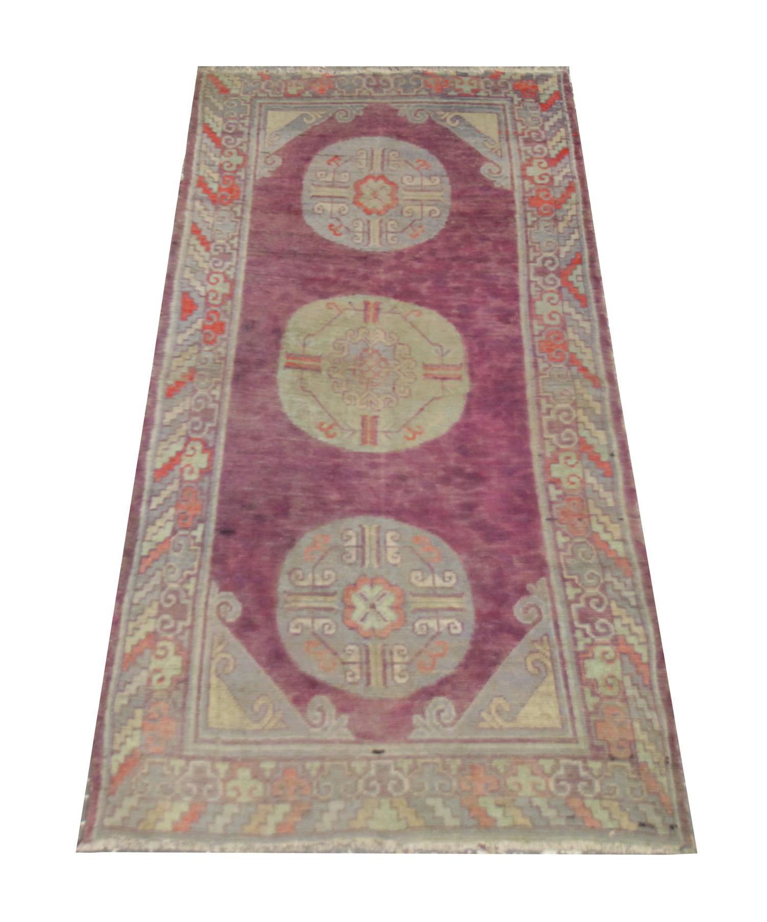 Handmade carpet Oriental rug truly unique in design and color this high-quality antique Central Asian Khotan Rug is perfect for any contemporary or traditional interior. The central design features thee circular emblems in green and blue with