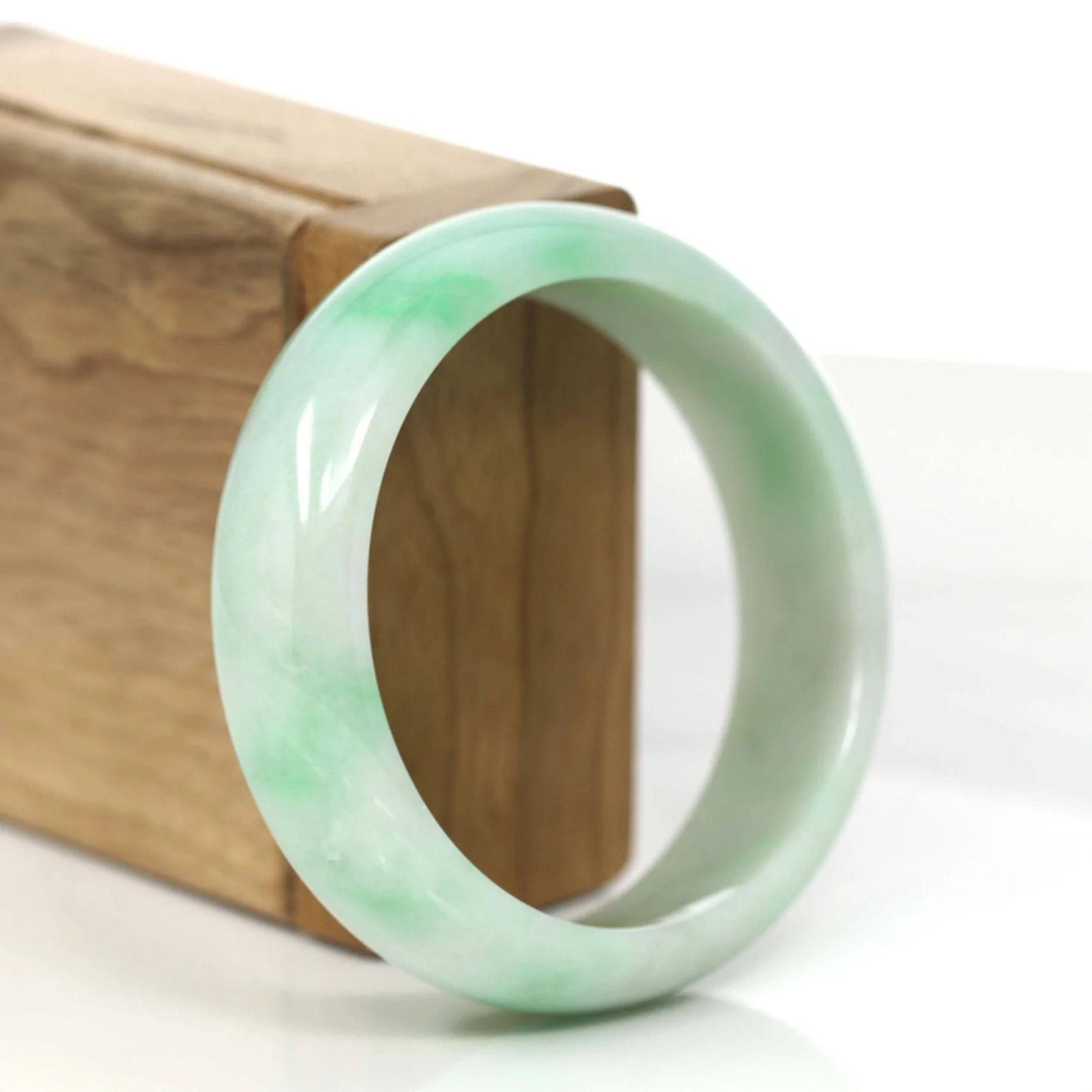 * DETAILS---This bangle is made with very high quality genuine apple green Burmese jadeite jade. The jade texture is very smooth and translucent with apple green patch all over, It is a very luxury and perfect bangle. Characterized by its wider