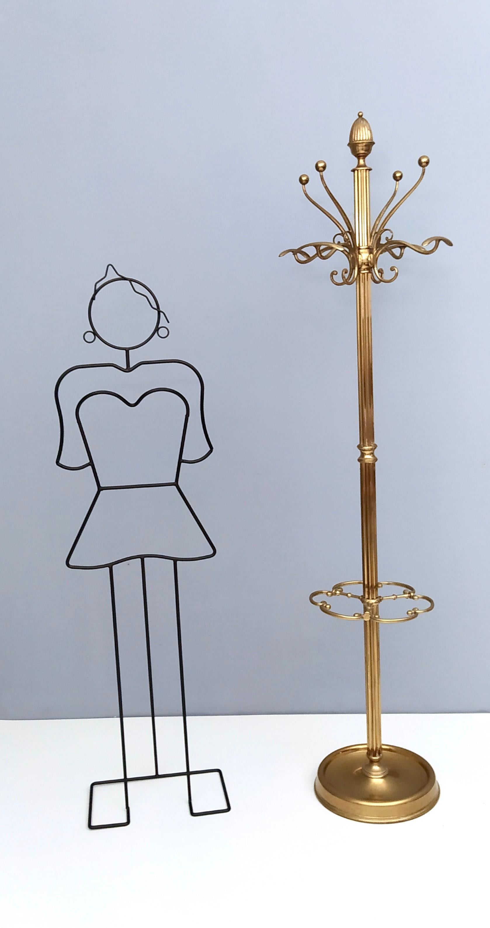 This hat and coat rack is made in solid brass, 1960s.
The hanging part is revolving and the lower part can also function as an umbrella stand.
It has its original patina which makes this piece even more beautiful.
This rack is a vintage piece,