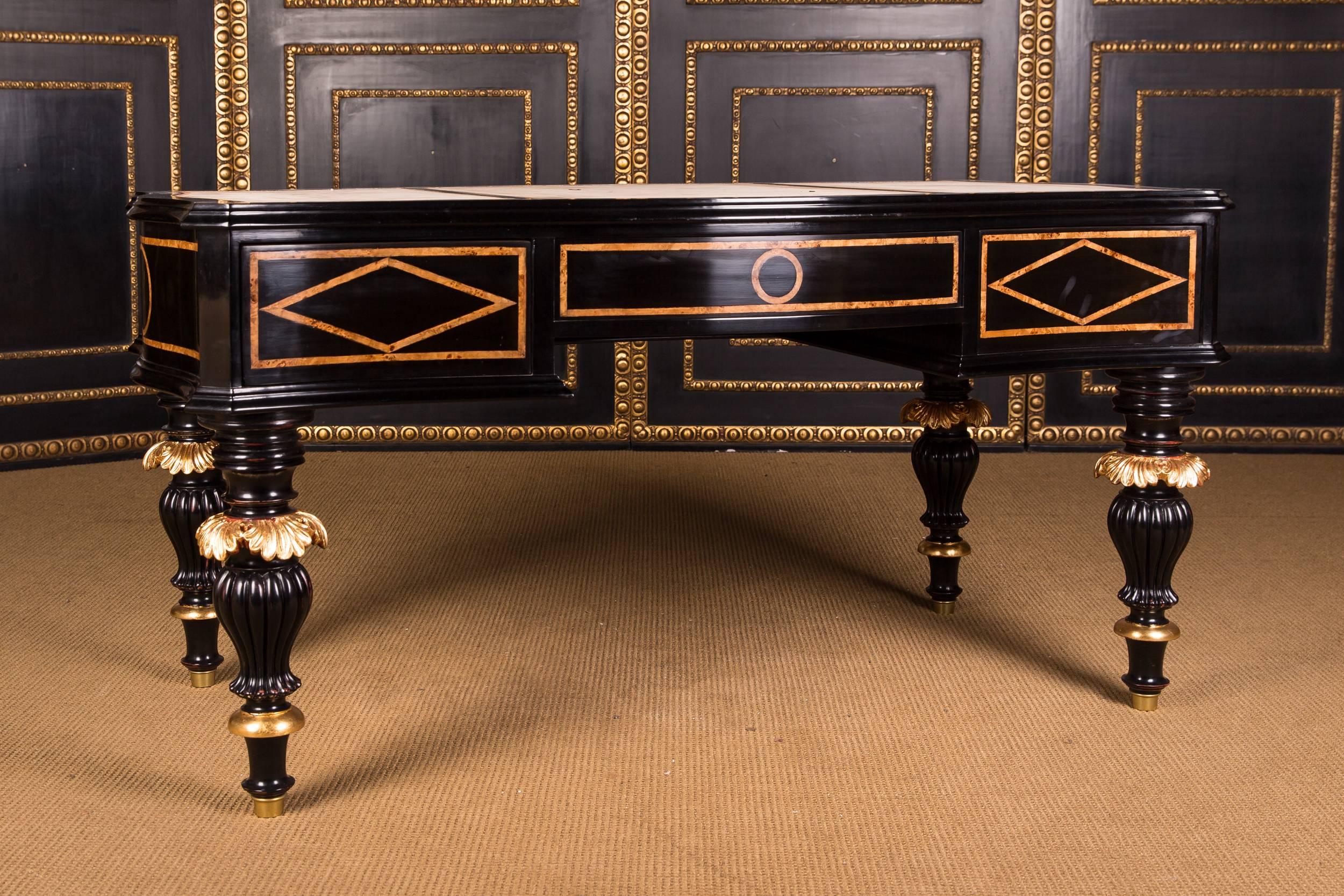Solid conifers and beech with thread inlays. Partially ebonized and gilded. Strongly cambered, four-sided, slightly curved, five-arched frame base with wide knee-pocket, finely carved baluster-shaped legs ending in sabots. Slightly protruding,