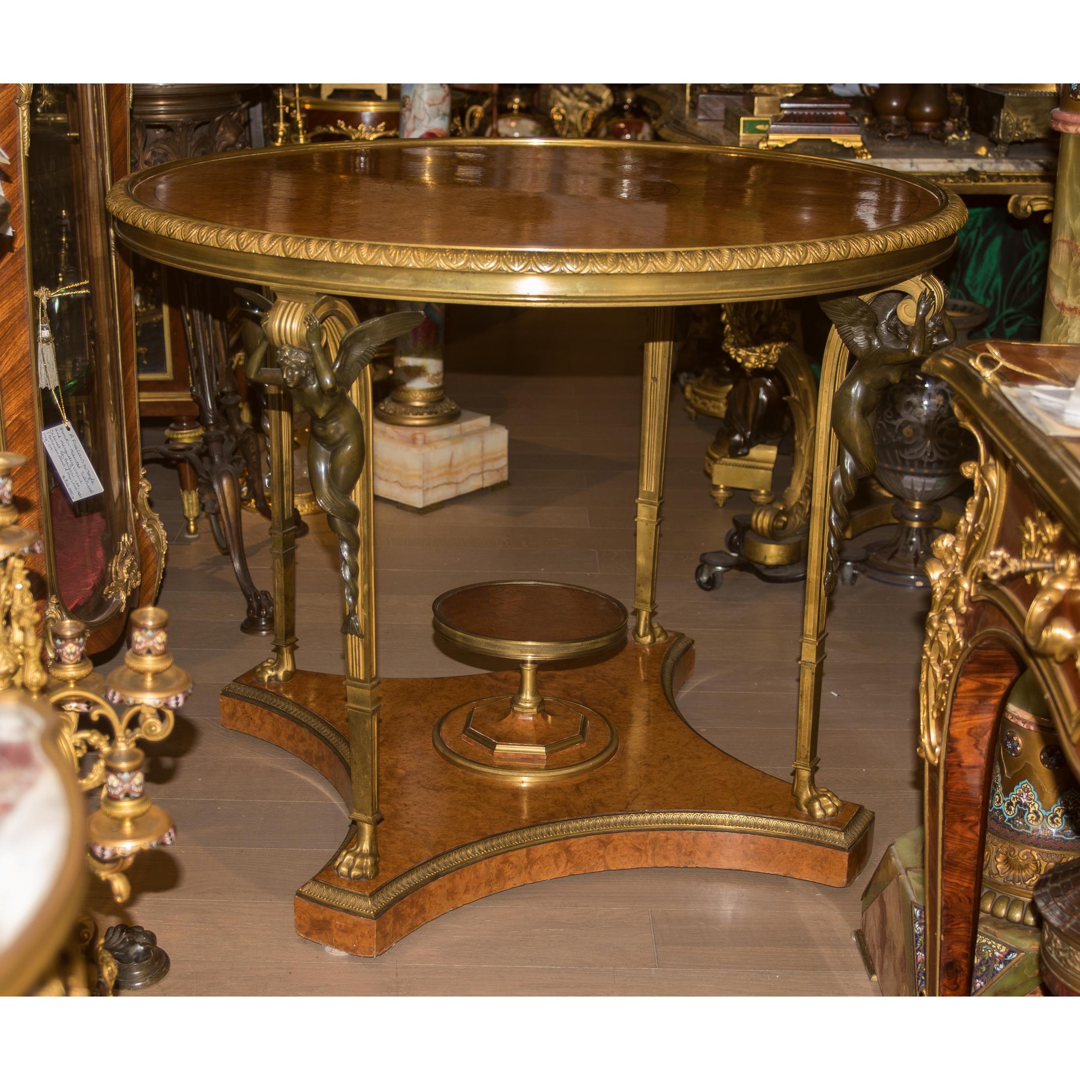 Exquisite High Quality Gilt and Patinated Bronze-Mounted Louis XVI Style Amboyna Center Table after The Fontainbleau model. Signed F. Linke

Maker: François Linke (1855-1946)
Date: Circa early 20th century
Origin: French
Dimension: 31 in. x 38