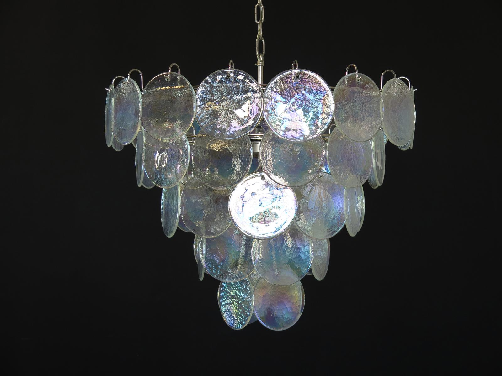 Italian Murano chandelier. The chandelier has 50 Murano iridescent glass disks. The glasses are now unavailable, they have the particularity of reflecting a multiplicity of colors, which makes the chandelier a true work of art. Nickel metal