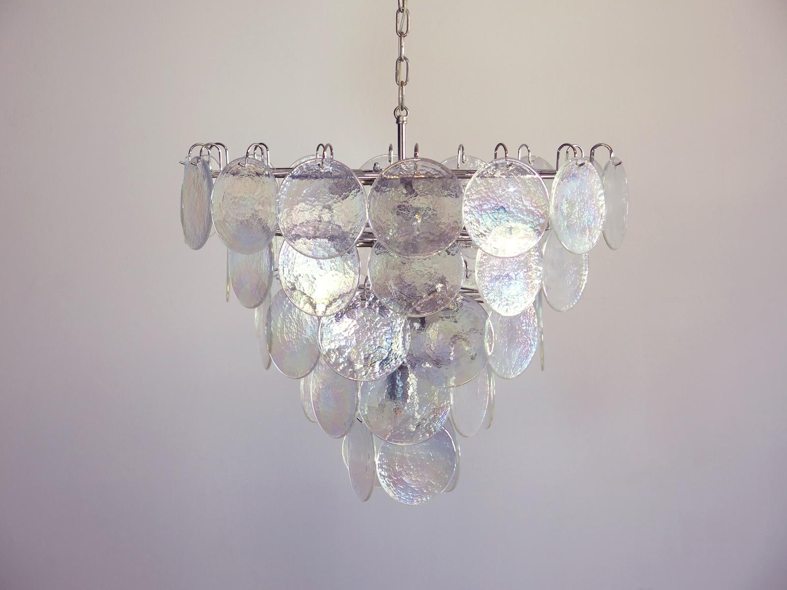 Italian Murano chandelier. The chandelier has 50 Murano iridescent glass disks. The glasses are now 
unavailable, they have the particularity of reflecting a multiplicity of colors, which makes the chandelier a 
true work of art. Nickel metal