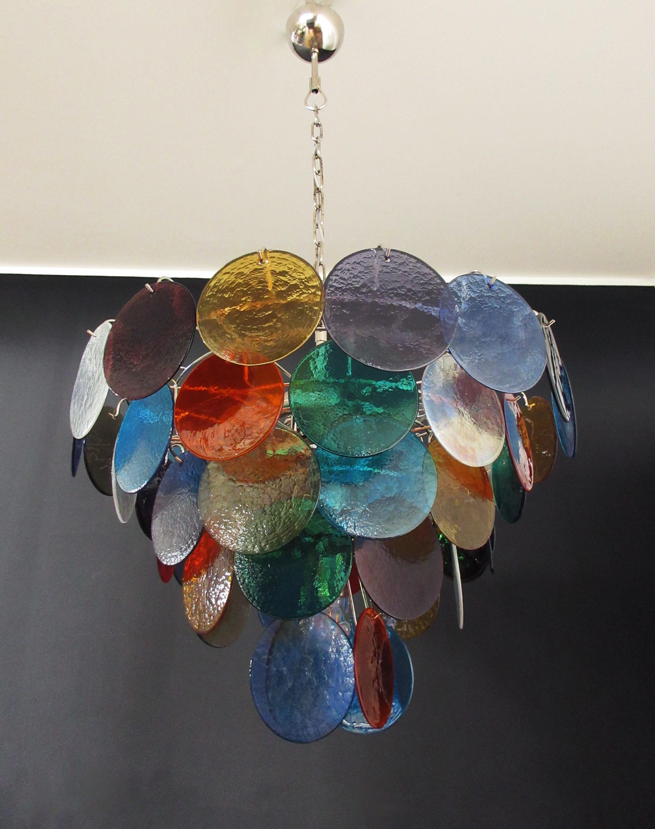 Italian Murano chandelier. The chandelier has 50 Murano multicolored glass disks. The glasses are now unavailable, they have the particularity of reflecting a multiplicity of colors, which makes the chandelier a true work of art. Nickel metal