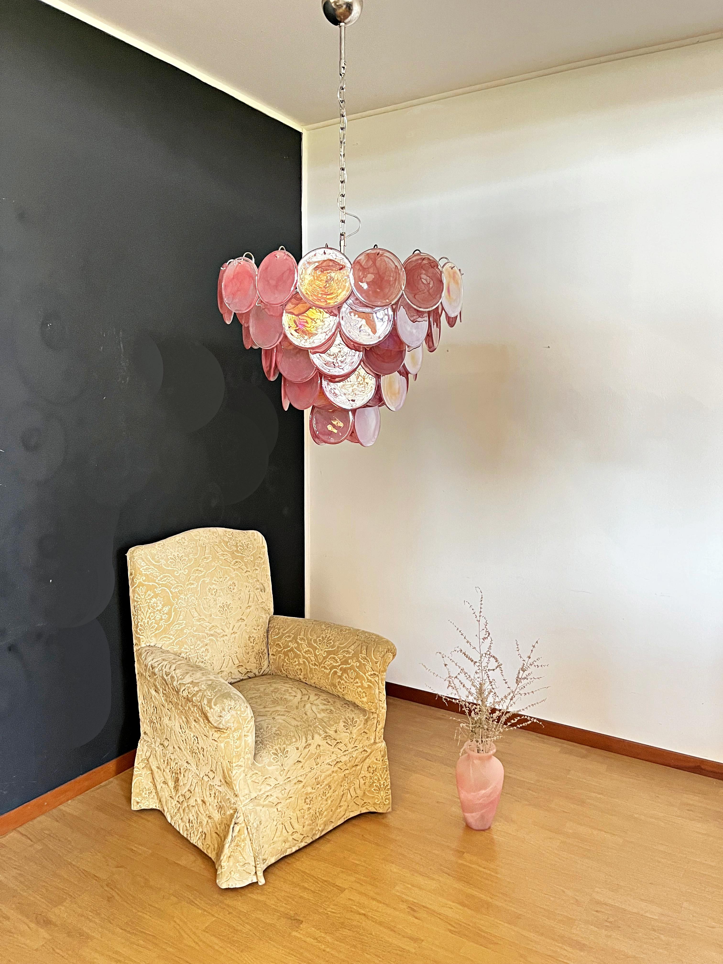 Italian Murano chandelier. The chandelier has 57 Murano PINK albaster iridescent glass disks. The glasses are now unavailable, they have the particularity of reflecting a multiplicity of colors, which makes the chandelier a true work of art. Nickel