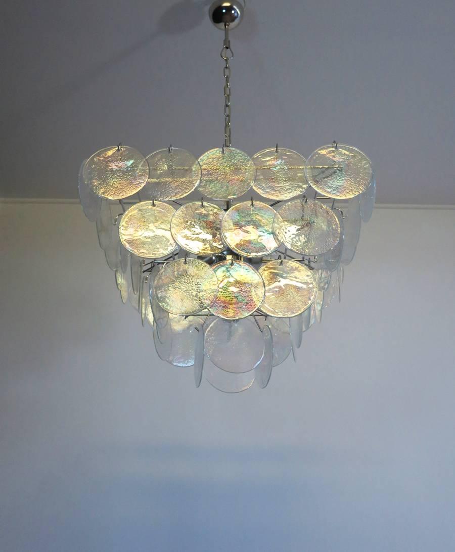 Italian Murano chandelier. The chandelier has 52 Murano iridescent glass disks. The glasses are now unavailable, they have the particularity of reflecting a multiplicity of colors, which makes the chandelier a true work of art. Nickel metal