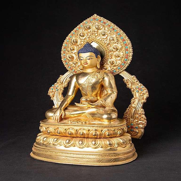 Material: bronze
38,3 cm high 
23,8 cm wide and 17,2 cm deep
Weight: 4.552 kgs
Fire gilded with 24 krt. gold - the face is gold painted
Bhumisparsha mudra
Originating from Nepal
Newly made in the highest quality !
