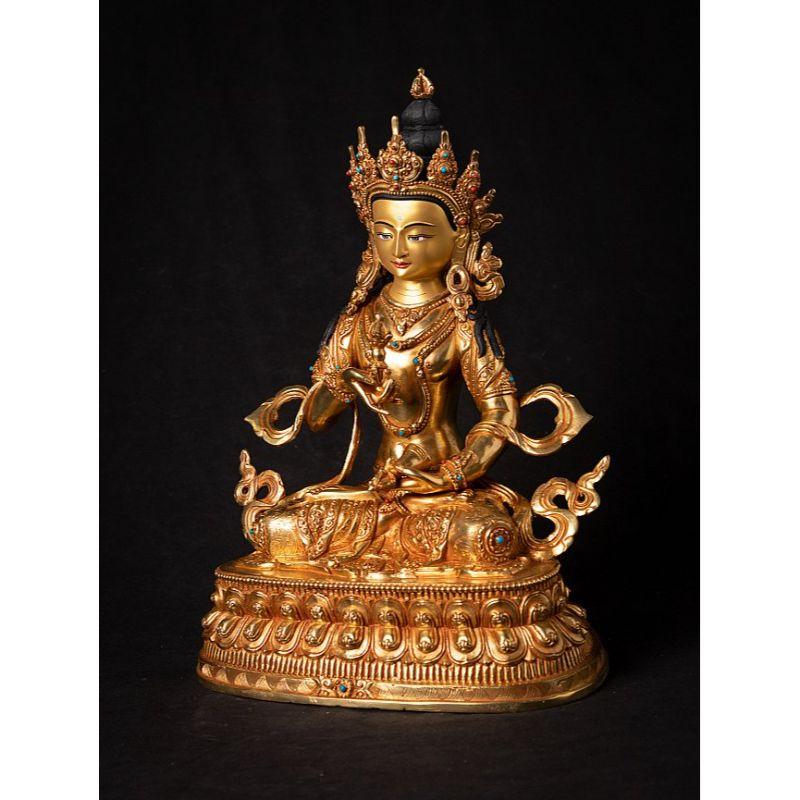Material: bronze
32,4 cm high 
23,3 cm wide and 16,2 cm deep
Weight: 3.733 kgs
Fire gilded with 24 krt. gold - the face is gold painted
Namaskara mudra
Originating from Nepal
Newly made in the highest quality!

