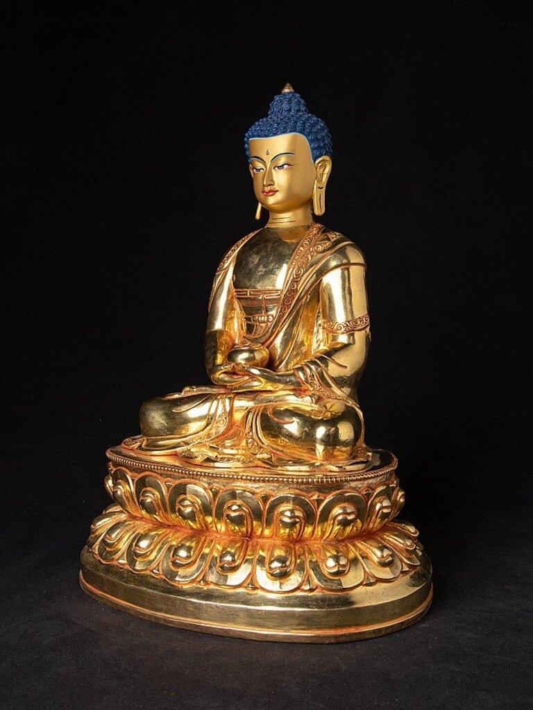 Material: bronze
35 cm high 
25,8 cm wide and 20,5 cm deep
Weight: 5.058 kgs
Fire gilded with 24 krt. gold - the face is traditionally gold painted
Dhyana mudra
Originating from Nepal
Newly made in high quality.
 