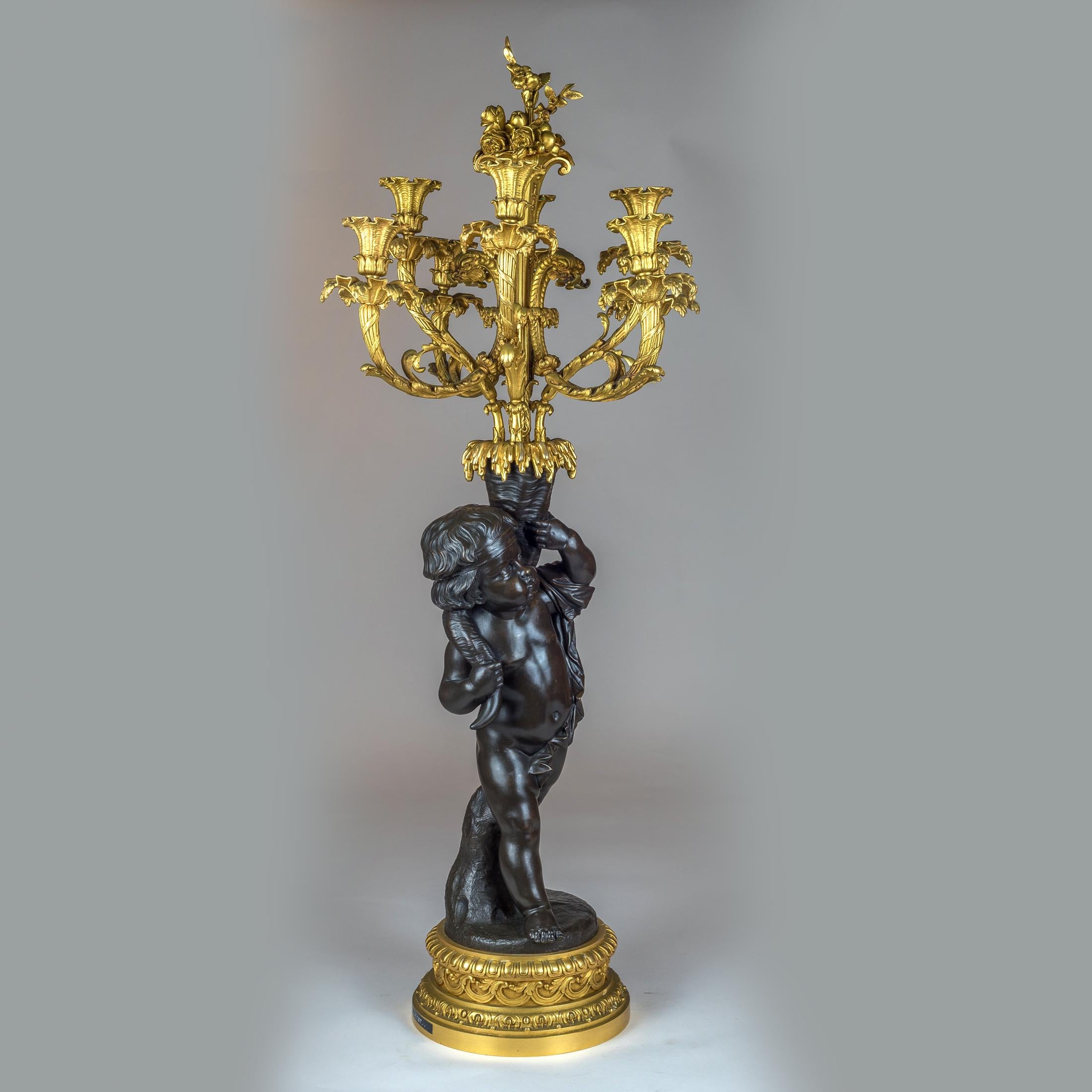 Rococo High Quality Pair of Patinated and Gilt Bronze Figural Candelabras