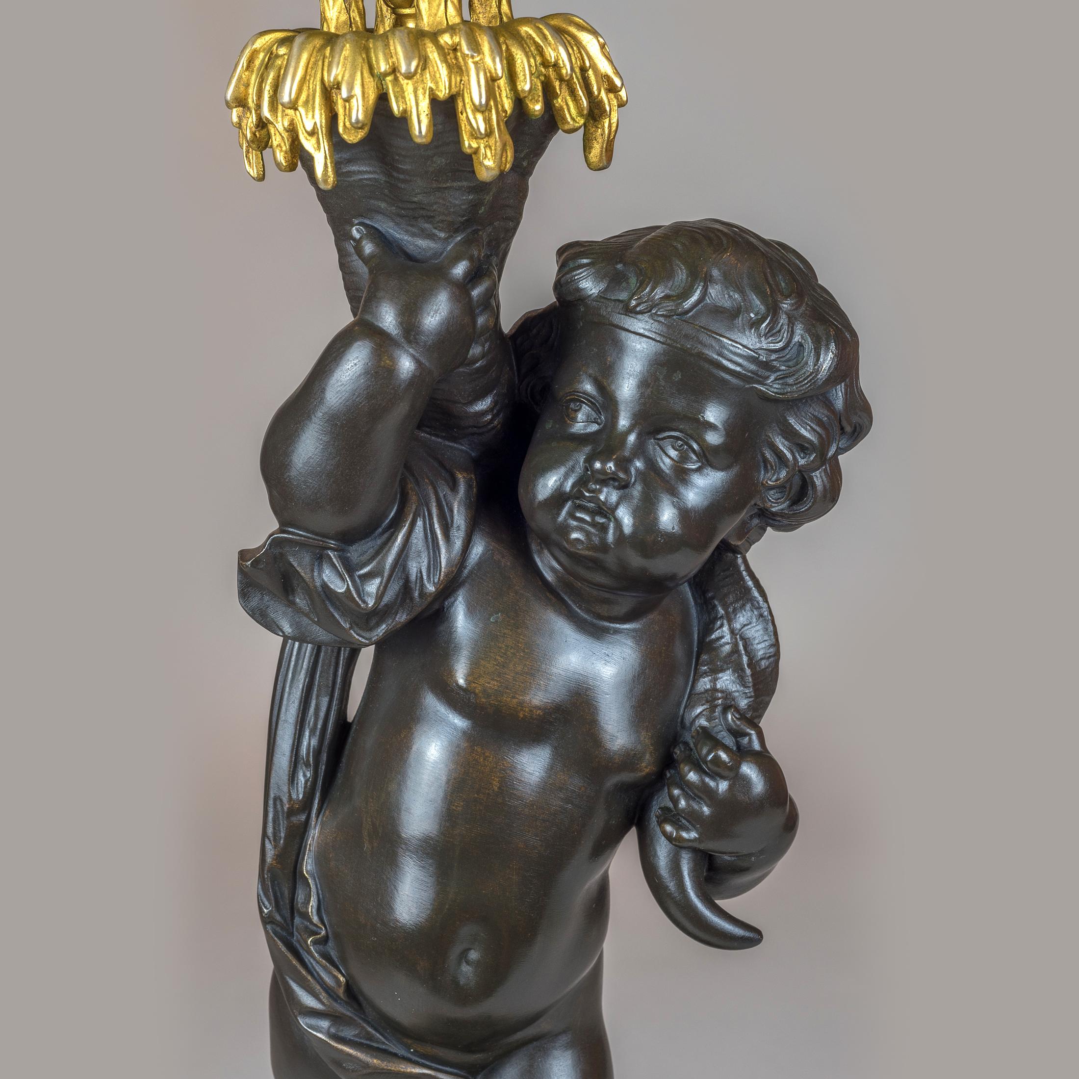 French High Quality Pair of Patinated and Gilt Bronze Figural Candelabras